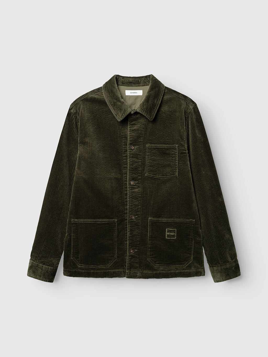 The GABbeta Ibre LS Overshirt in Forest Night by Gabba is a dark green stretch corduroy jacket featuring a collar, button-down front, and three utility pockets, displayed flat against a light grey background—a versatile layering essential for any wardrobe.