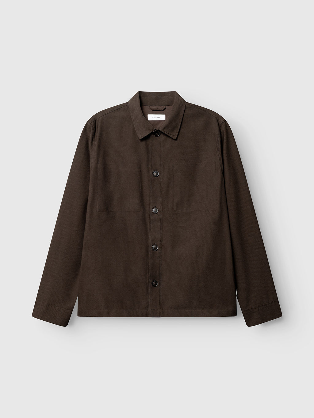 The Gabba GABtogger Base Deme LS Overshirt in Brown Slate is a regular fit, long-sleeve button-up jacket with a collar, crafted from lightweight overshirt material and displayed against a light gray background.
