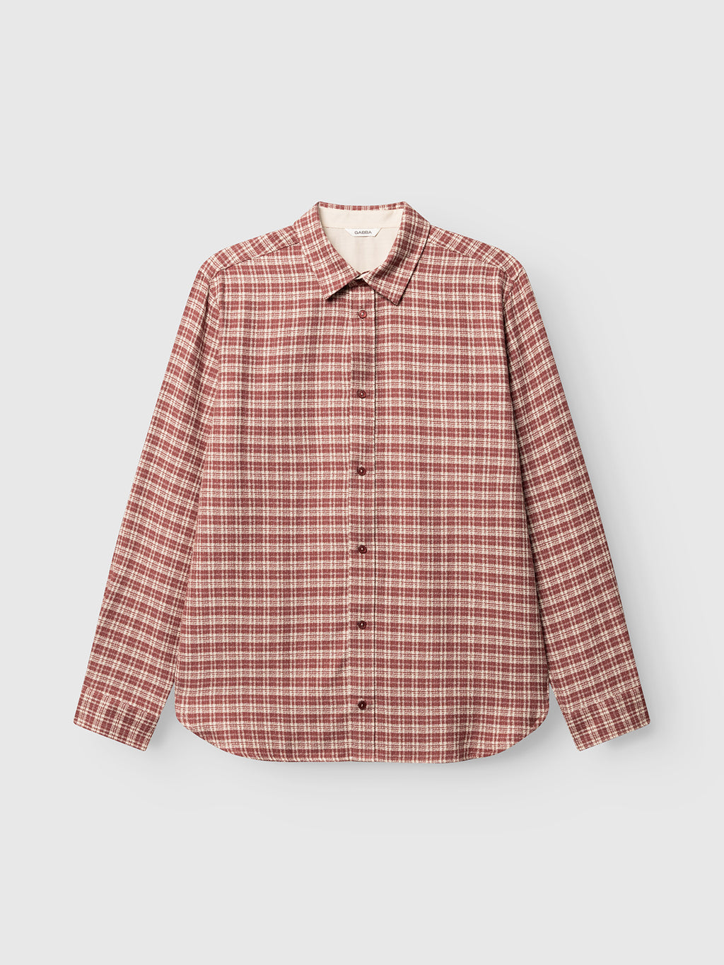 The GABsven Reg TX2 LS Shirt by Gabba features a regular fit and a long-sleeve button-up design, showcasing a brick red and white plaid checked pattern crafted from soft, yarn-dyed cotton, pictured laying flat on a white background.