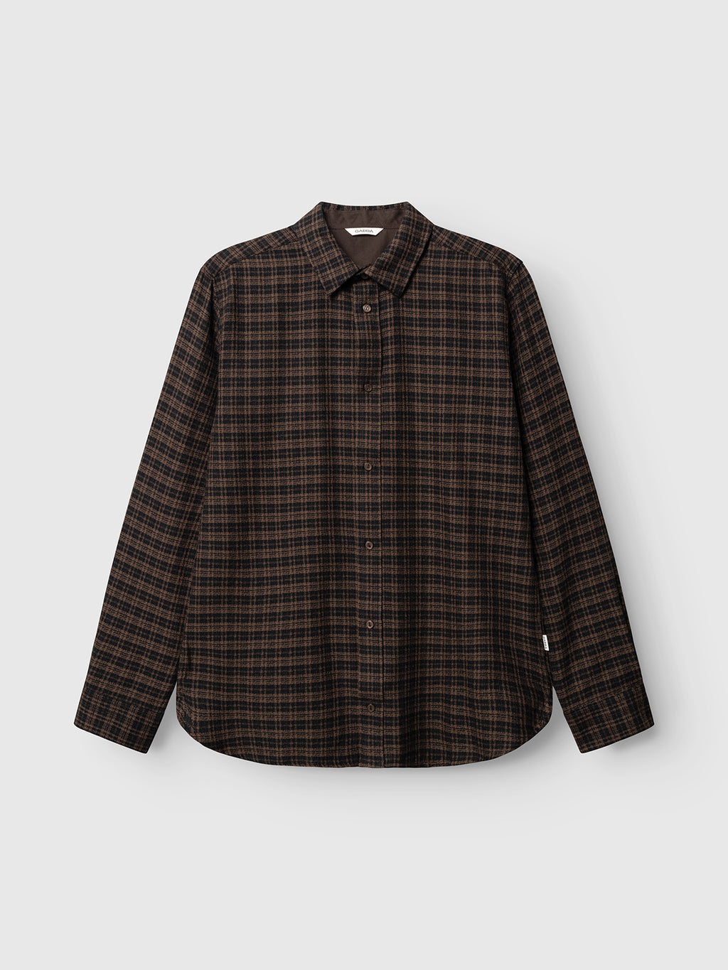 The Gabba GABsven Reg TX2 LS Shirt - Brown Slate is showcased against a white background. This regular fit, long-sleeved shirt features a brown and black plaid pattern, classic collar, button-up front, and curved hem. Crafted from yarn-dyed cotton by Gabba, it boasts a distinctive checked texture for timeless style.