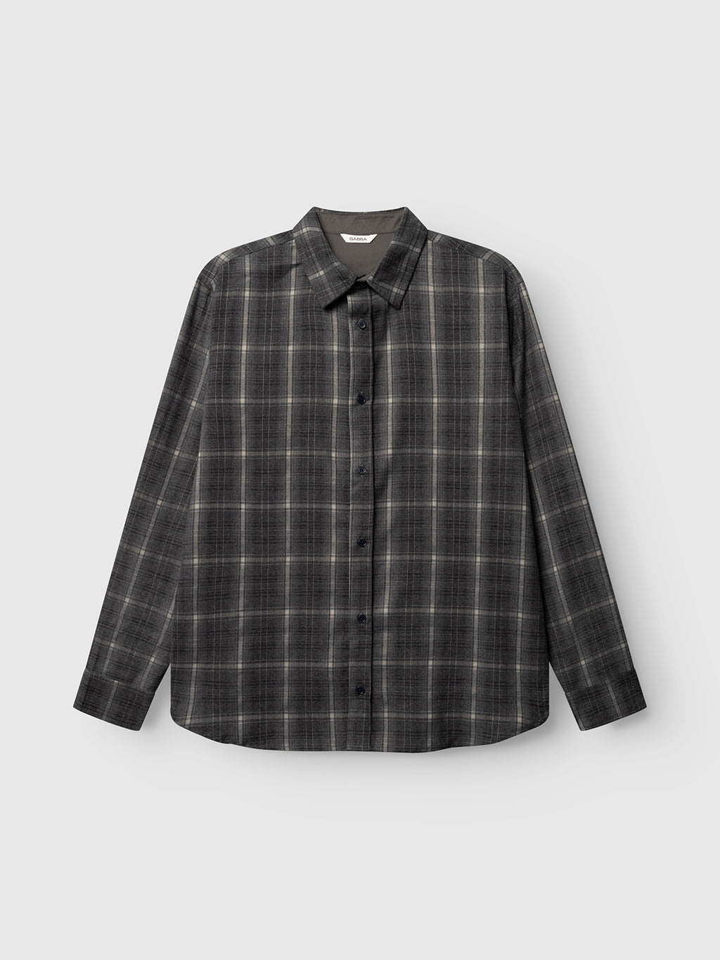 The Gabba GABsven Reg F1097 LS Shirt in Night Sky is a regular-fit, long-sleeved, button-up shirt with a black and gray checked pattern, crafted from a comfortable stretch-viscose blend and displayed against a plain light gray background.