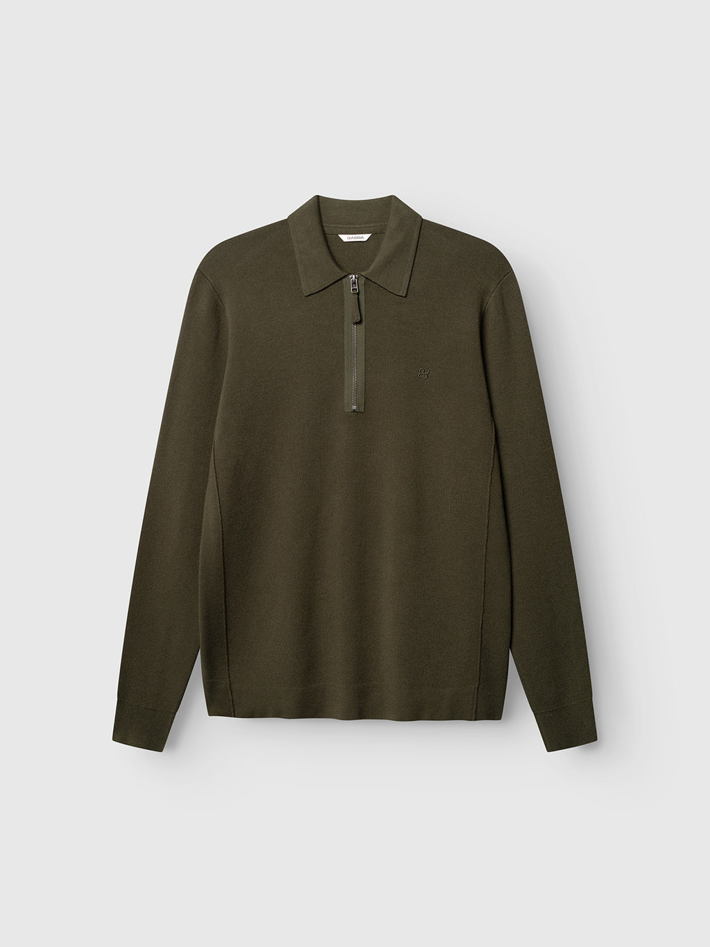 The Gabba GABadriel Half Zip Lume LS Knit in Forest Night is a long-sleeve polo shirt crafted from a soft viscose blend knit, displayed flat against a light background. Featuring a zip-up collar, subtle logo on the left chest, and a regular fit for everyday comfort.