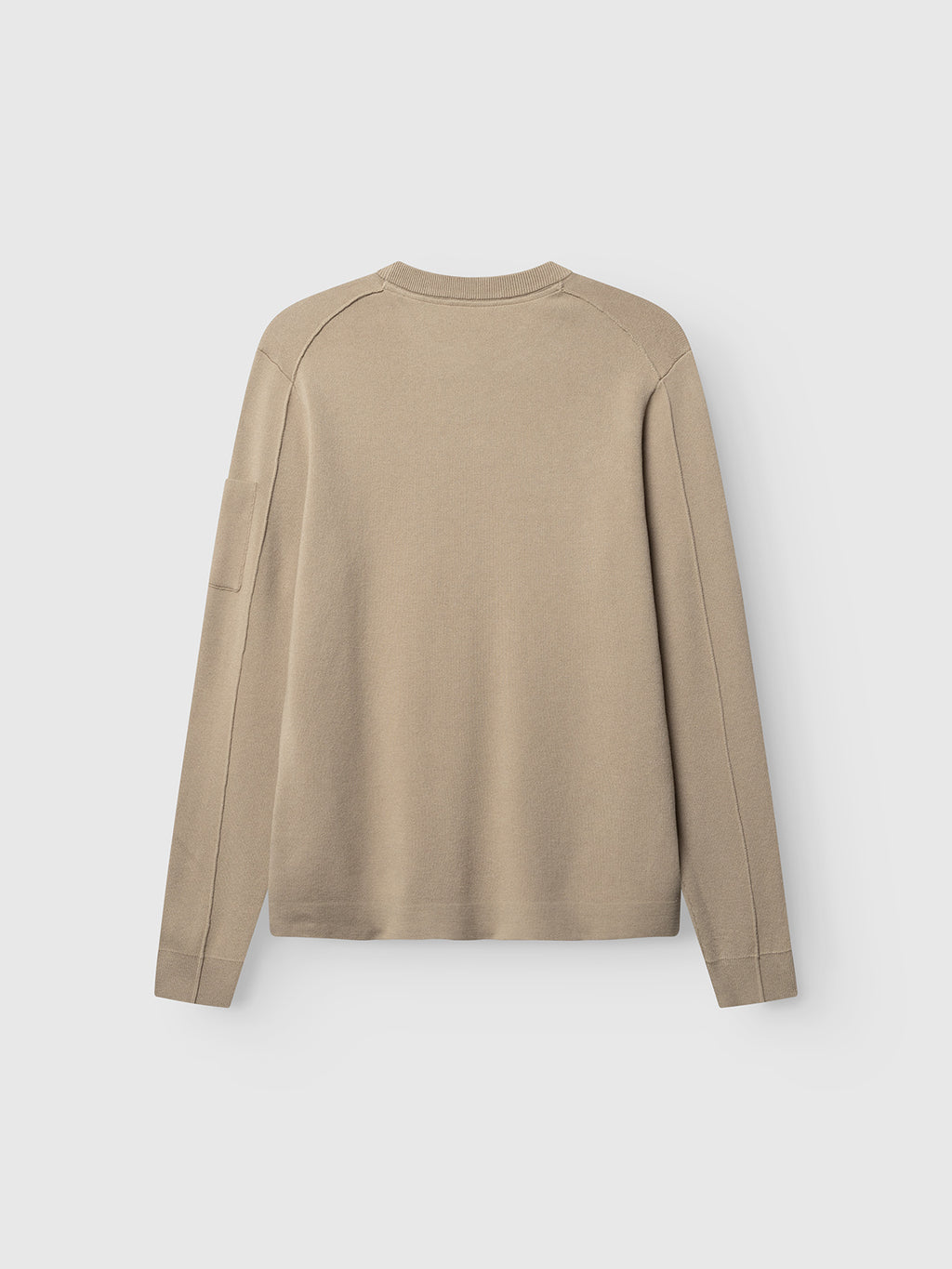 The Gabba GABadriel O-Neck Lume LS Knit in Sand Crocker, a regular fit beige long-sleeve sweater made from a soft viscose blend knit and featuring a classic crew neck along with a subtle pocket on the left sleeve, is shown laid flat against a plain light background with the back view visible.