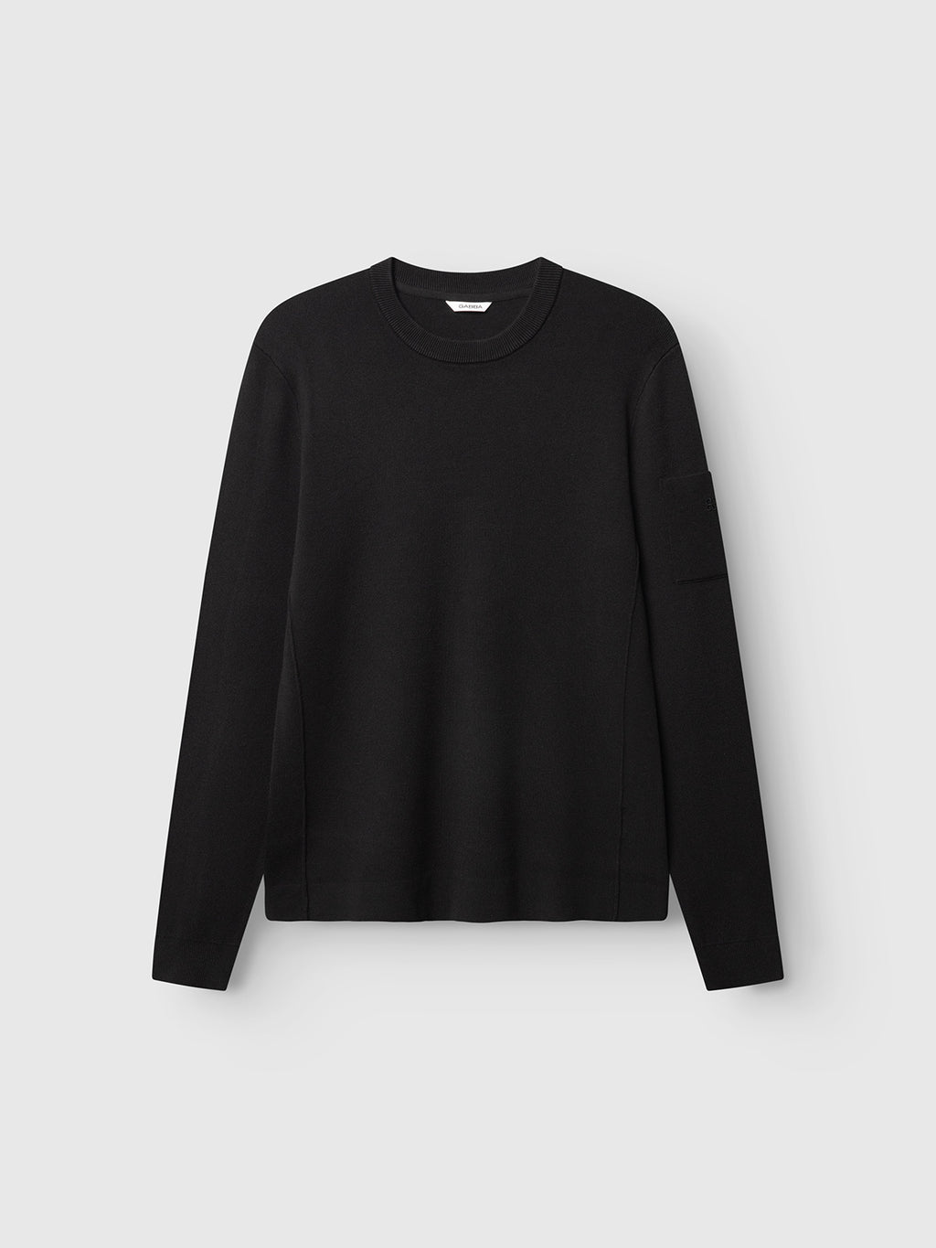 The GABadriel O-Neck Lume LS Knit sweater by Gabba in the ‘Meteorite’ color is laid flat on a light gray background. Crafted from a soft viscose blend knit, this regular-fit long-sleeve crew neck features a clean, minimalist design with no visible patterns or embellishments.