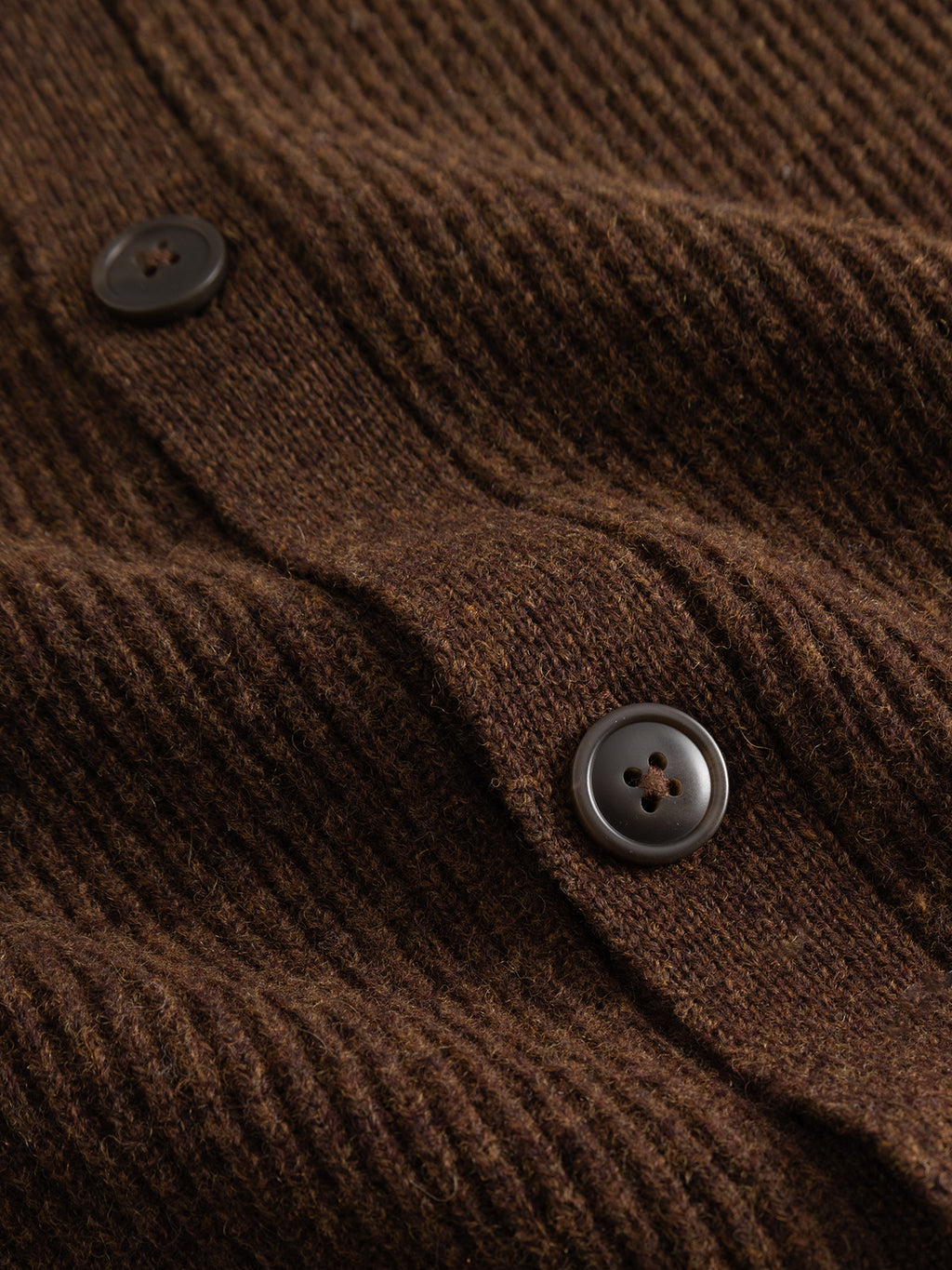 Close-up of the Gabba GABremy Cardi Flash LS Knit in Brown Slate, featuring a relaxed fit, rib-knit texture, and two dark brown buttons sewn on to highlight detailed stitching.
