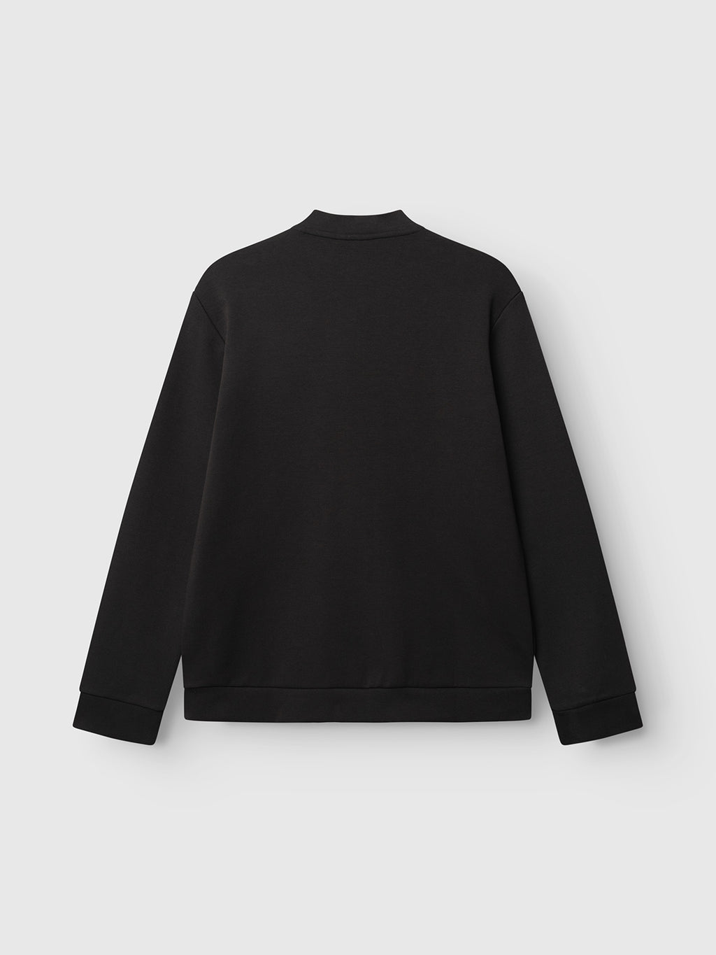 The Gabba GABnik Camp Lock Sweat - Meteorite is shown from the back against a light gray background. Made from mid-weight interlock fabric, this plain black long-sleeve sweatshirt features a minimalist design with no visible logos or patterns.