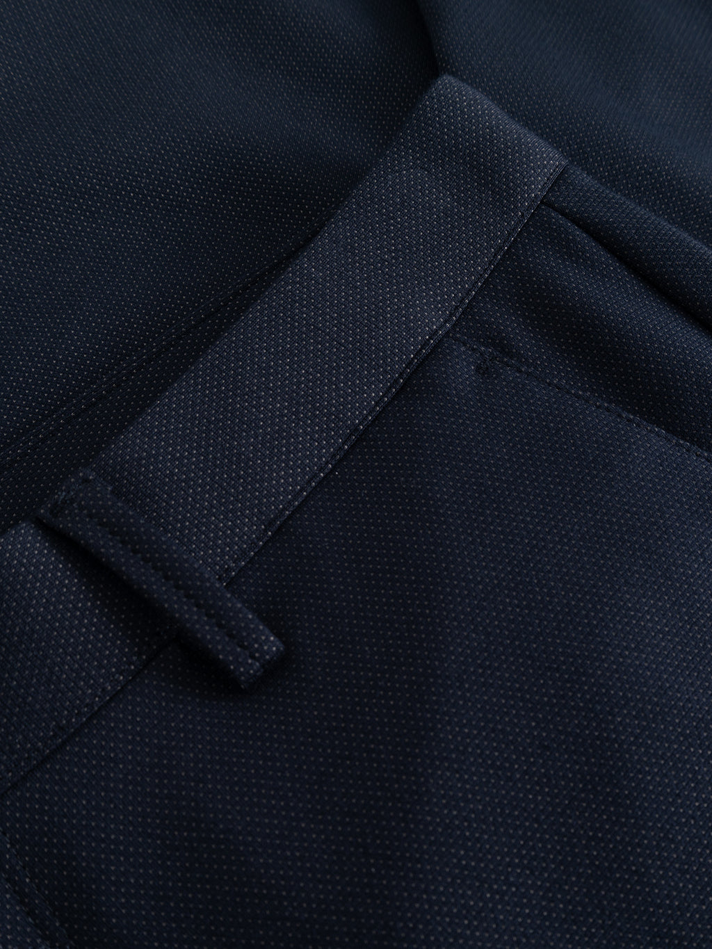 Close-up of the Gabba GABpaul Dotty Pant in navy, highlighting its slim chino fit and the texture of its superstretch fabric, with detailed views of the belt loop, pocket seam, and waistband.
