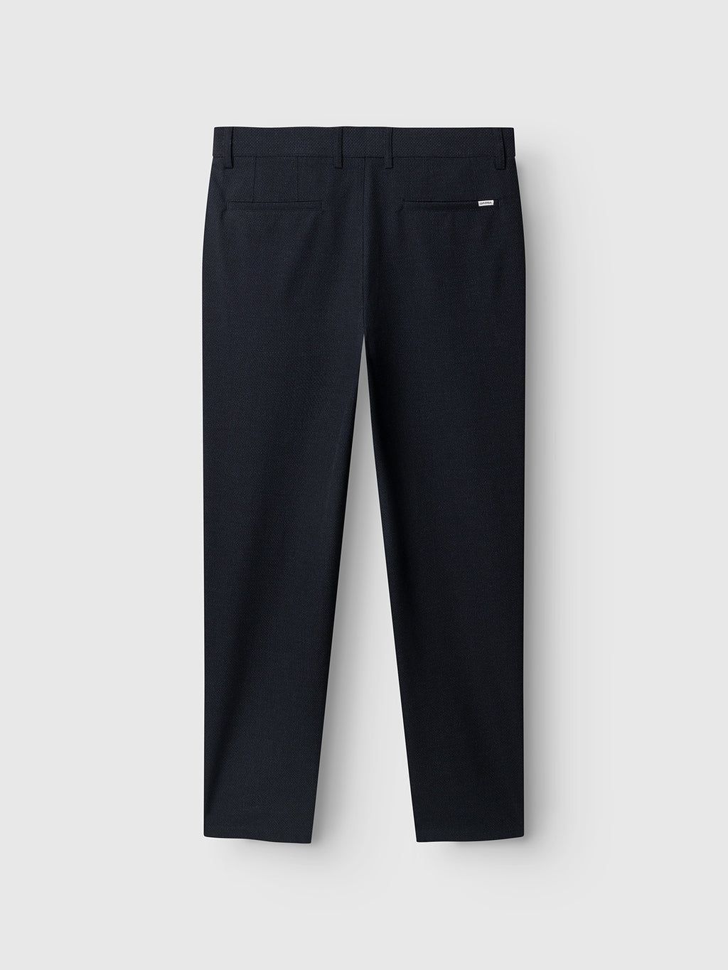Sure! Here’s your revised sentence using the provided product data: The Gabba GABjoe-pas Rubin Pant in Blue Black is displayed flat from the back, showcasing belt loops, two back pockets, and straight legs crafted from stretch dobby fabric against a light gray background.