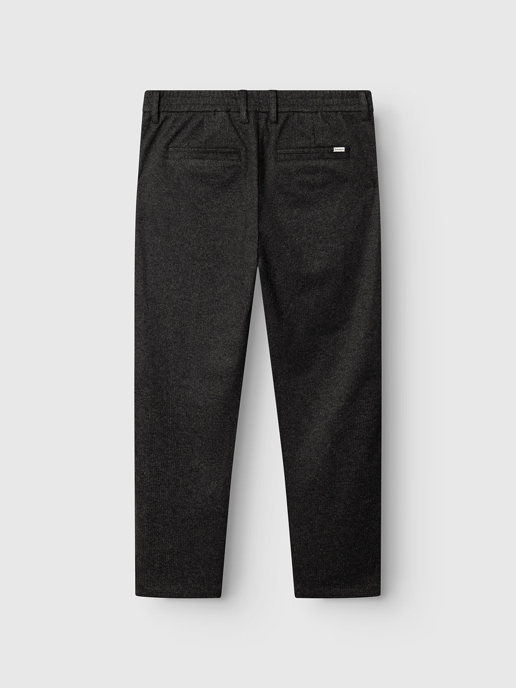 Back view of the Gabba GABmonza Cropped Tasca Zaffe GRS Pant in dark grey, featuring a relaxed straight fit with belt loops and two back pockets—one with a button closure—set against a light gray background. Designed with a sophisticated wool-look finish.
