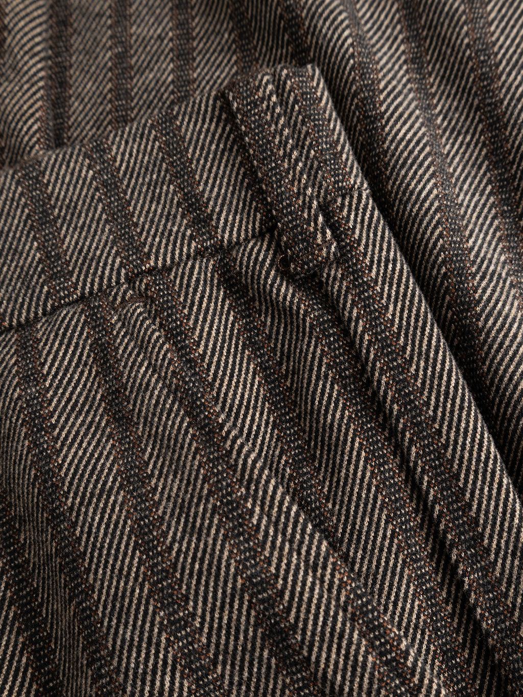 Close-up of the GABnapoli 19 Zapies Pant - Brown Slate from Gabba, featuring brown and beige wool-look stripe fabric with diagonal lines and a visible seam, showcasing the comfortable stretch material used in these regular straight fit trousers.