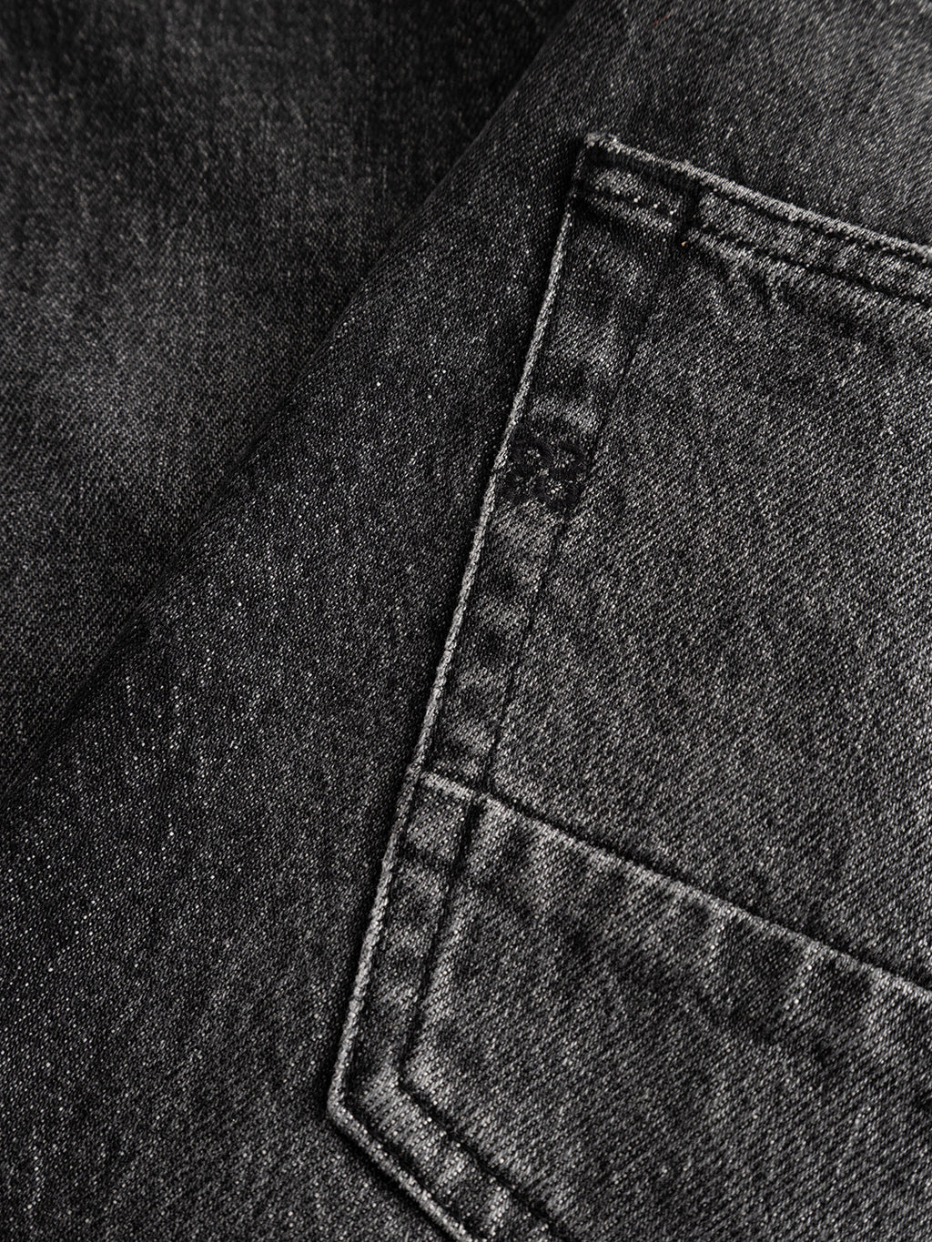 Close-up of the Gabba GABcarl Blackrow DH0011 Jeans in black denim, highlighting the washed black finish and visible back pocket with detailed stitching that showcases the texture and weave of the comfort stretch material.