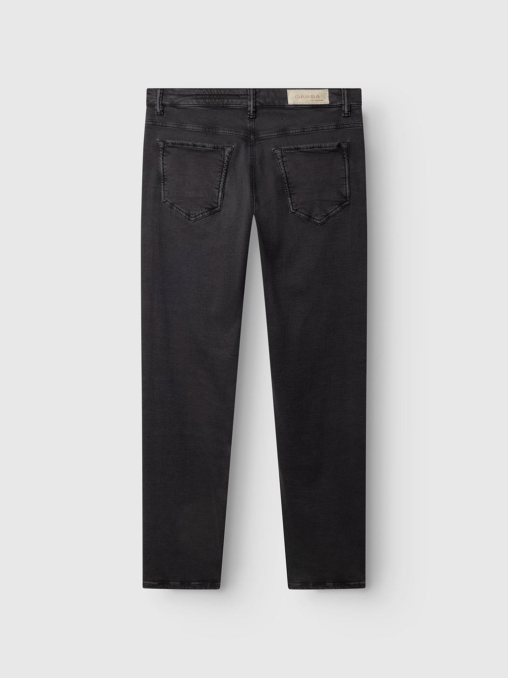 A pair of GABjones Hesky Jeans in black denim by Gabba, displayed flat from the back, featuring two back pockets and a light-colored rectangular brand patch on the waistband.
