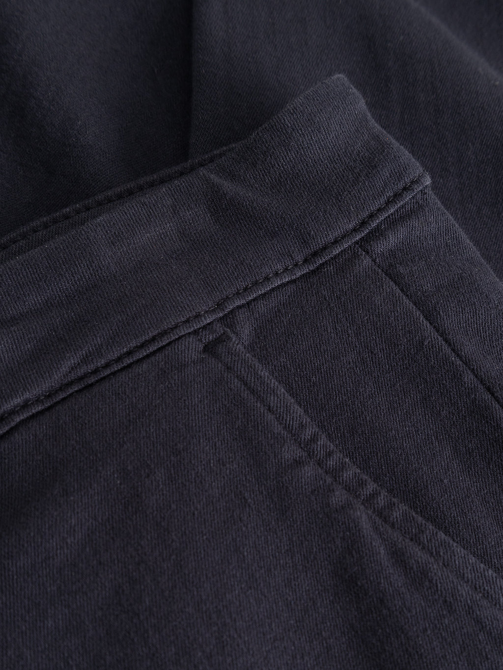 Close-up of the Gabba GABpaul Hesky Pant in Navy, highlighting the waistband and front pocket details. The high-stretch, garment-dyed fabric and precise stitching are clearly showcased, emphasizing both texture and craftsmanship.