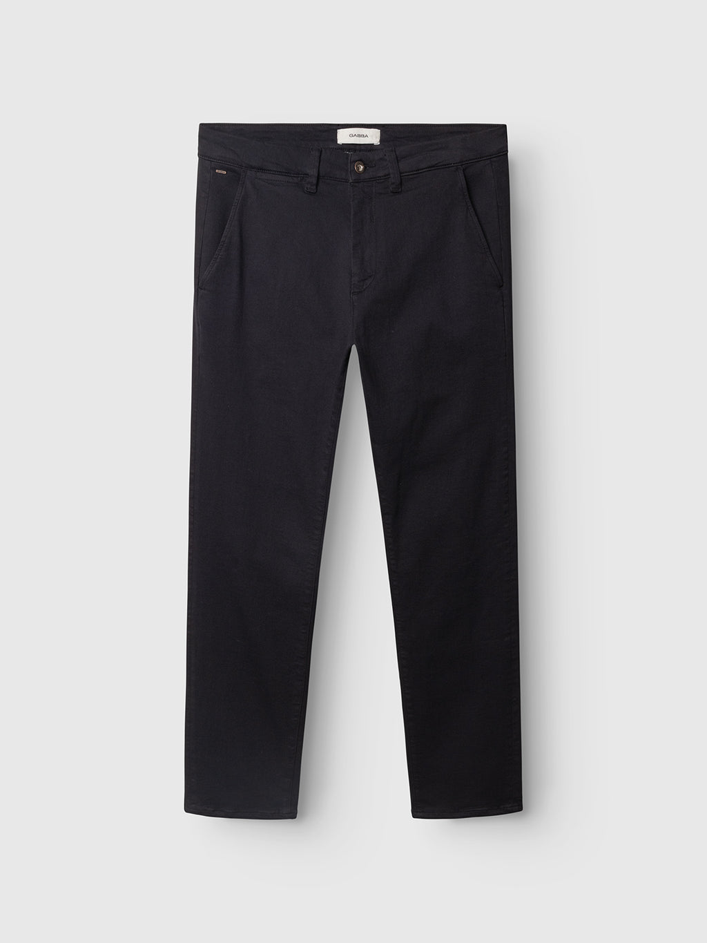 A pair of GABpaul Hesky Pant - Navy by Gabba, featuring a straight-leg chino design with side pockets, belt loops, and a button closure. Crafted from high-stretch garment-dyed fabric for optimal comfort and flexibility, these versatile trousers are photographed laid flat against a plain light background.
