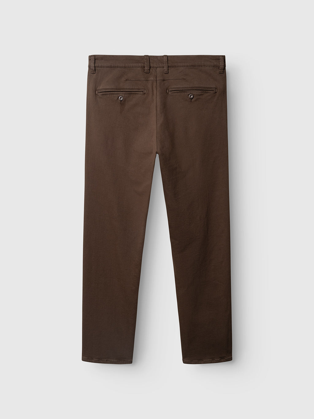 Back view of the Gabba GABpaul Hesky Pant in brown, featuring two back pockets with button closures and belt loops at the waistband. These slim chino-fit pants are crafted from high-stretch, garment-dyed fabric and are laid flat on a white background.