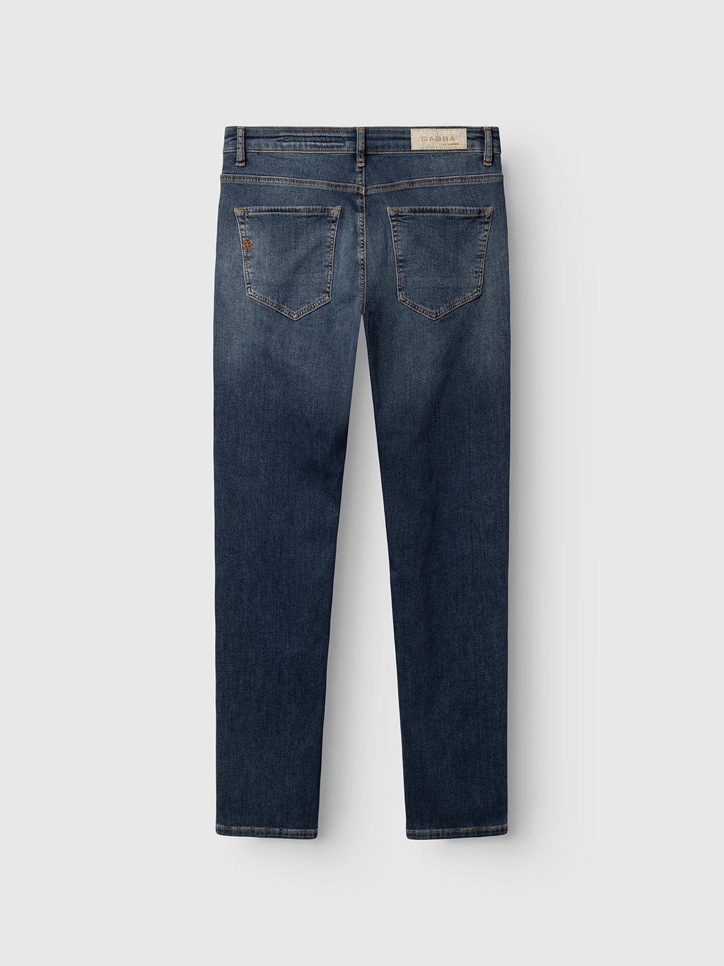 The Gabba GABjones2 Nham RS2113 Jeans in dark blue denim are shown from the back, highlighting two rear pockets and a tan leather patch on the waistband. Crafted from performance stretch denim for extra comfort, these slim straight fit jeans are laid flat on a white background.