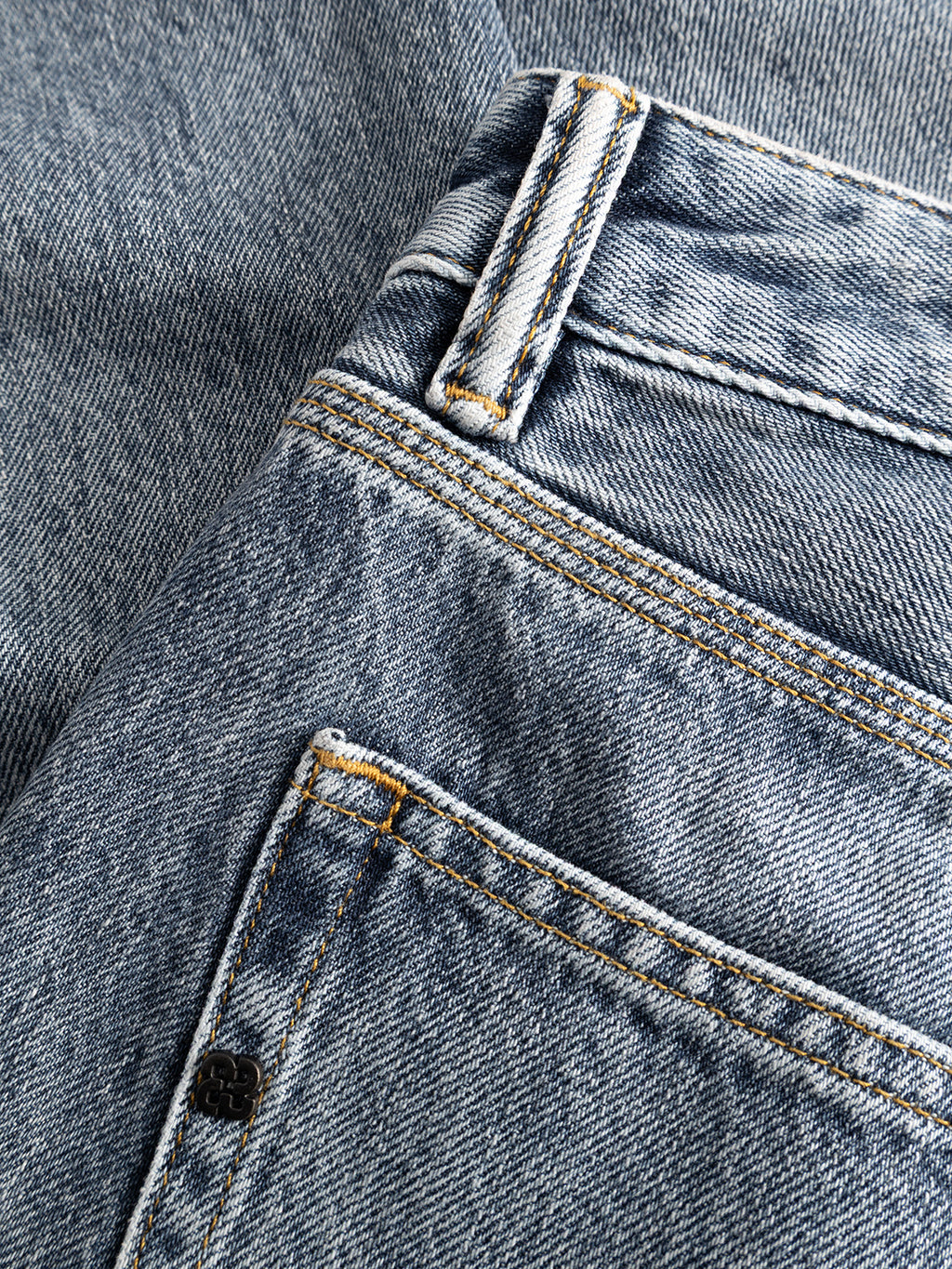 Close-up of the GABcarl Stone RS2103 Jeans by Gabba in mid blue denim, highlighting the front pocket, belt loop, detailed stitching, and textured premium fabric.