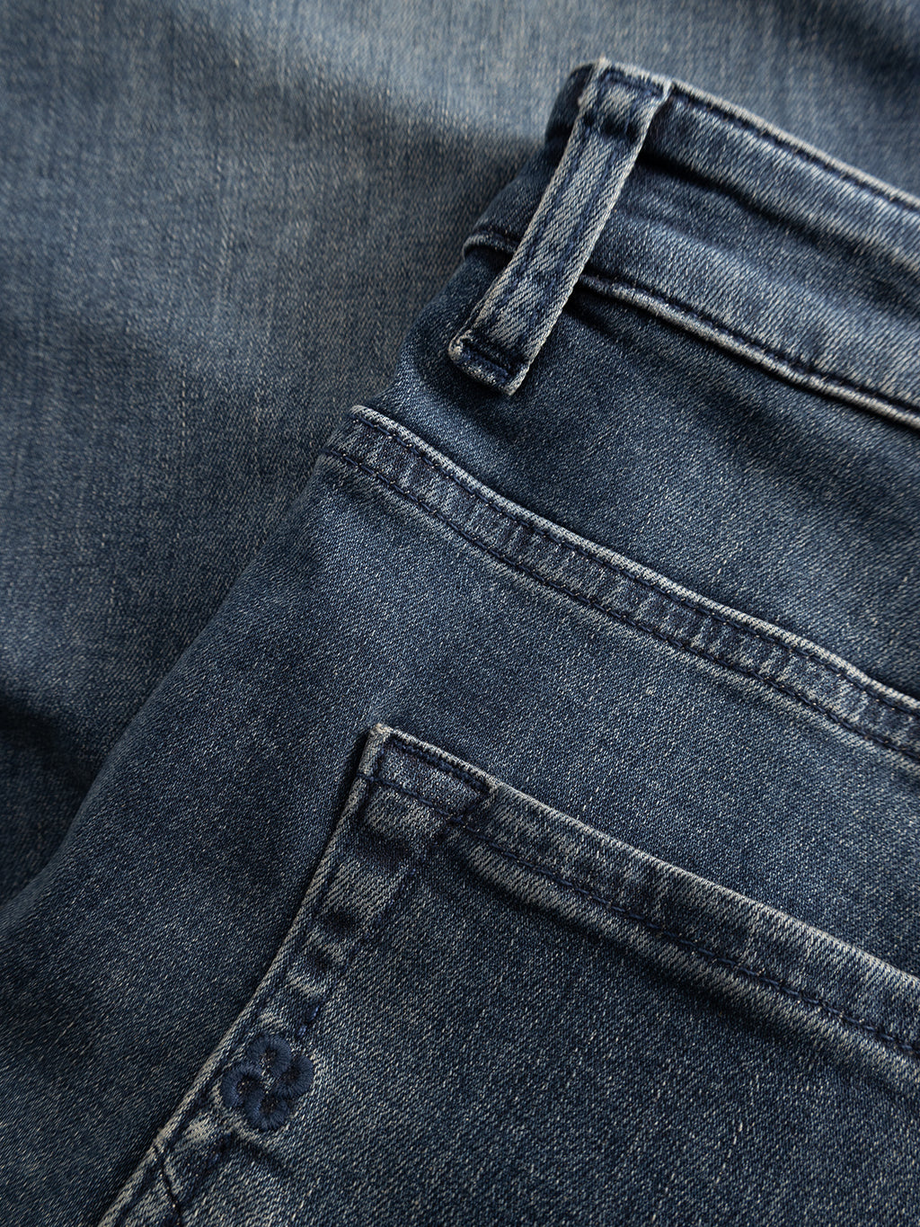 Close-up of Gabba GABmarc Nham RS2113 Jeans in dark blue denim, featuring a waistband with belt loops, defined pocket edges, and visible stitching that highlights the texture and weave of the regular fit fabric.