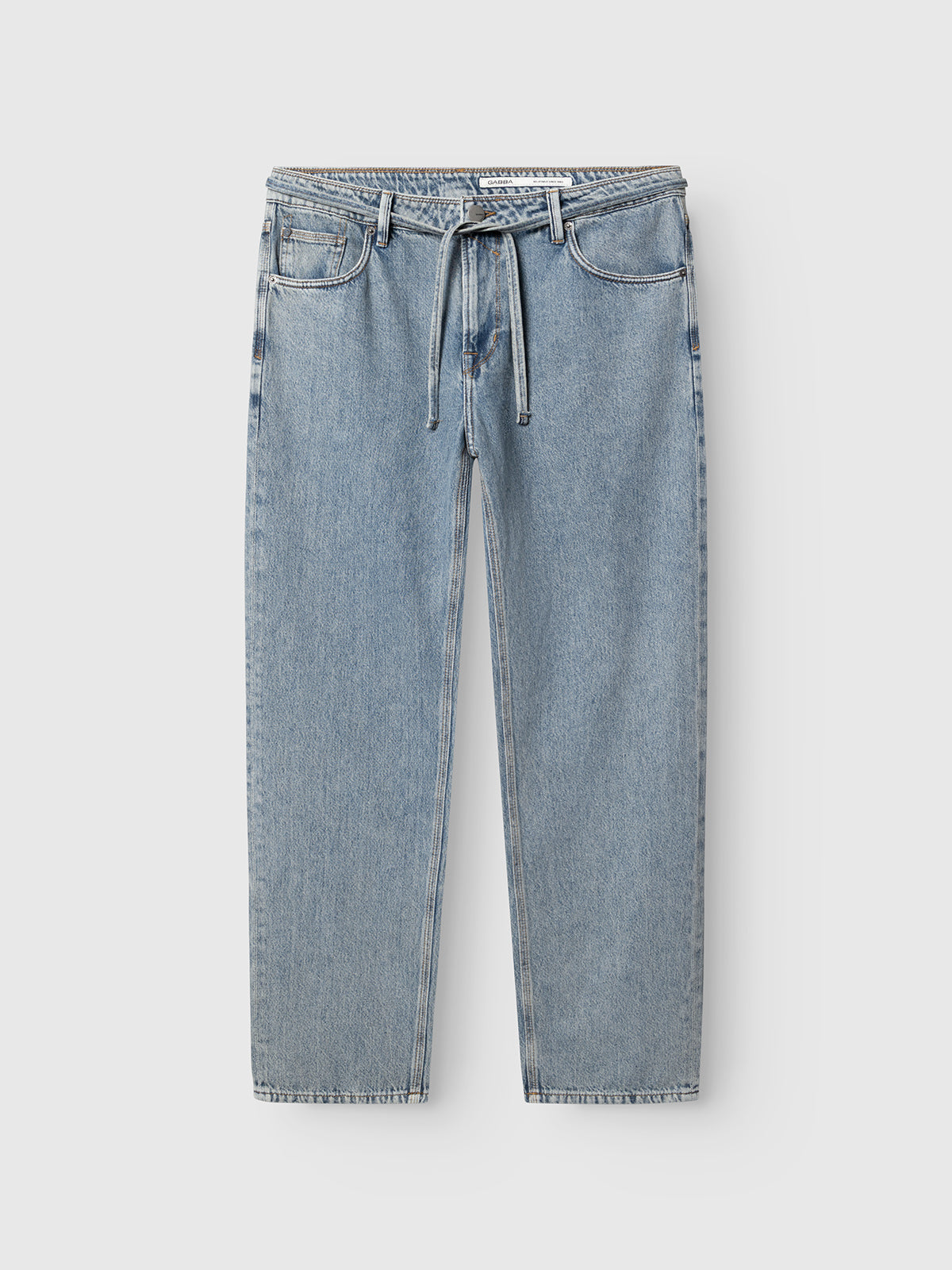 GABmax Tona RS2100 Jeans by Gabba in mid blue denim feature a modern straight fit, drawstring waist, five pockets, and subtle fading, crafted from organic cotton. The jeans are displayed laid flat on a white background.
