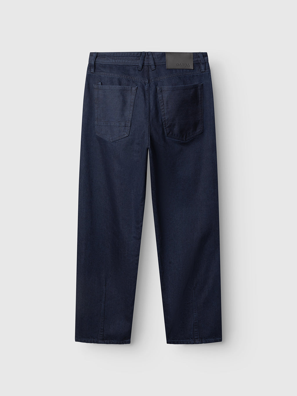 The GABsenna Denia Rinse Jeans by Gabba are shown from the back, crafted from dark blue-black denim. Featuring two back pockets, straight legs, belt loops, and a black leather patch on the waistband, these relaxed fit jeans offer both comfort and classic style.