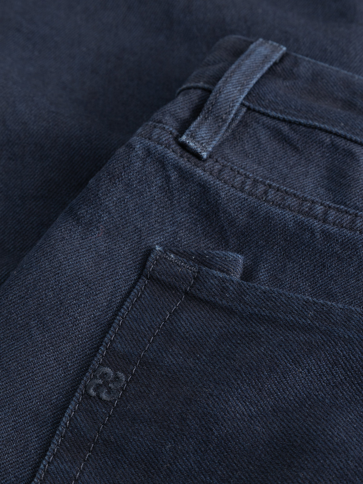 Close-up view of the front pocket area of the Gabba GABsenna Denia Rinse Jeans in dark blue denim, highlighting the stitching, belt loop, and fabric texture.
