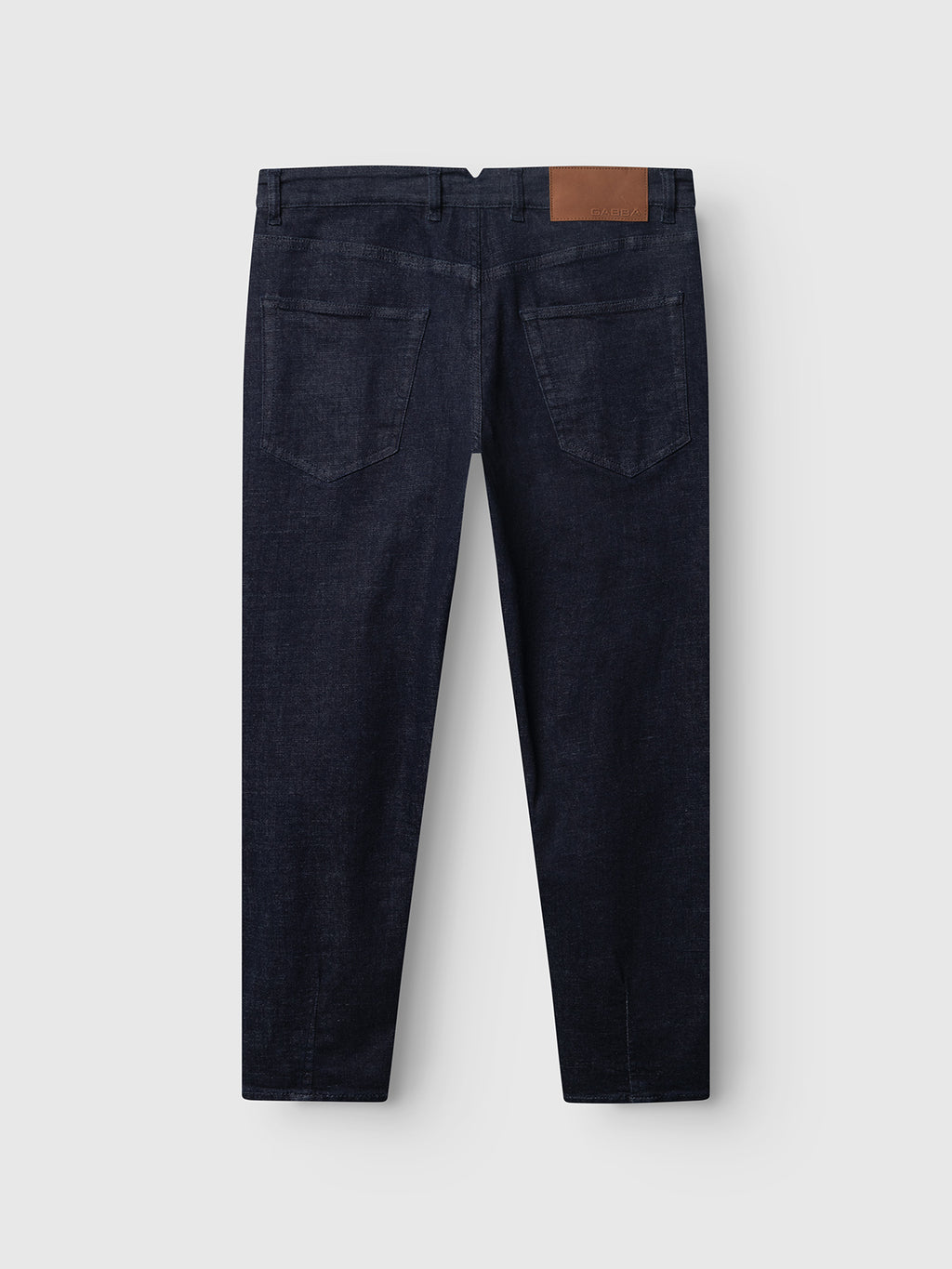 The Gabba GABalex Cropped Bekham DS0001 Jeans in dark blue denim are displayed from the back, featuring two back pockets, a brown leather patch on the waistband, belt loops, and straight legs. Made from comfort stretch denim with a dark rinse wash, these jeans appear on a plain white background.