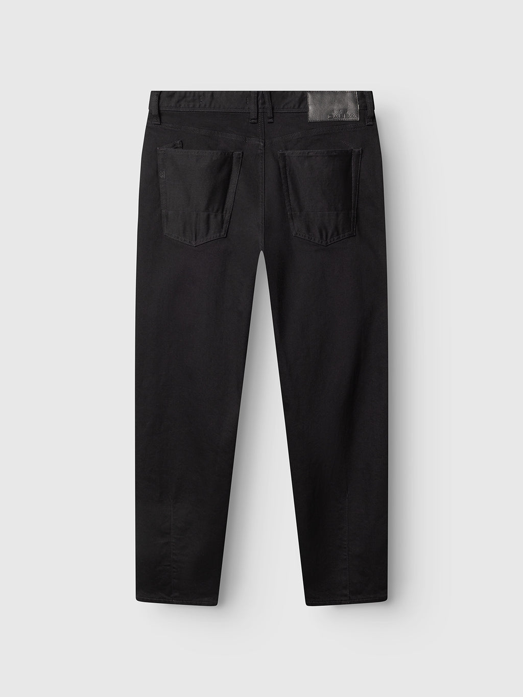 Back view of the Gabba GABsenna Black DS0006 Jeans in black denim, showcasing a loose tapered fit, two large rear pockets, and a black patch near the waistband. Made from comfort stretch twill with a garment-dyed black finish and displayed on a light gray background.