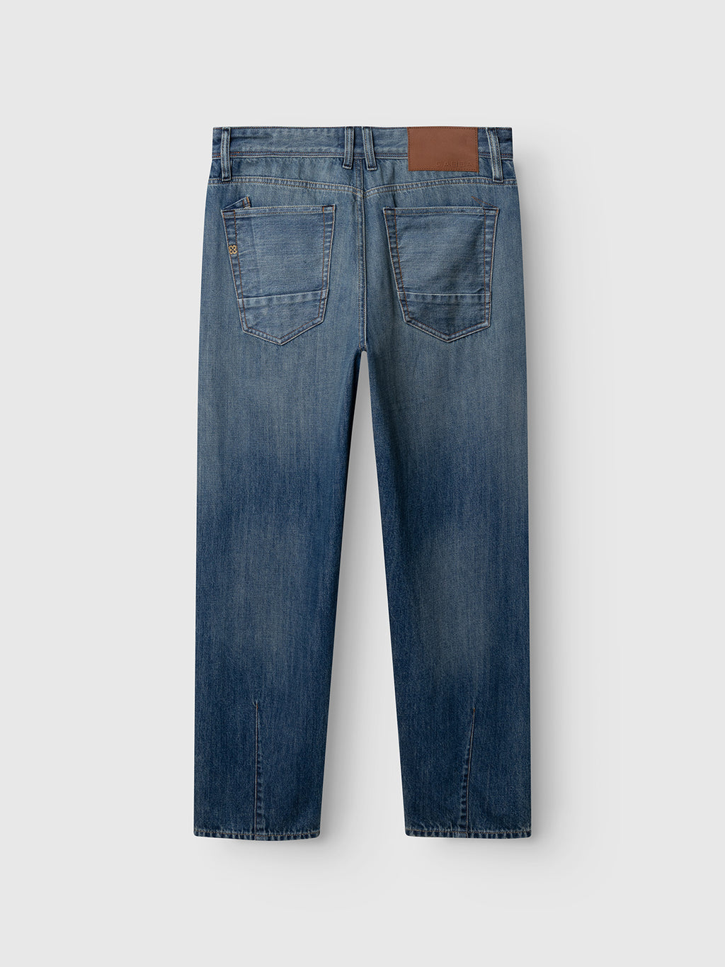 Back view of Gabba GABsenna Wolv DS0004 Jeans in dark blue denim, featuring a relaxed fit, two rear pockets, a tan leather patch on the waistband, and a straight-leg cut, displayed against a plain light gray background.