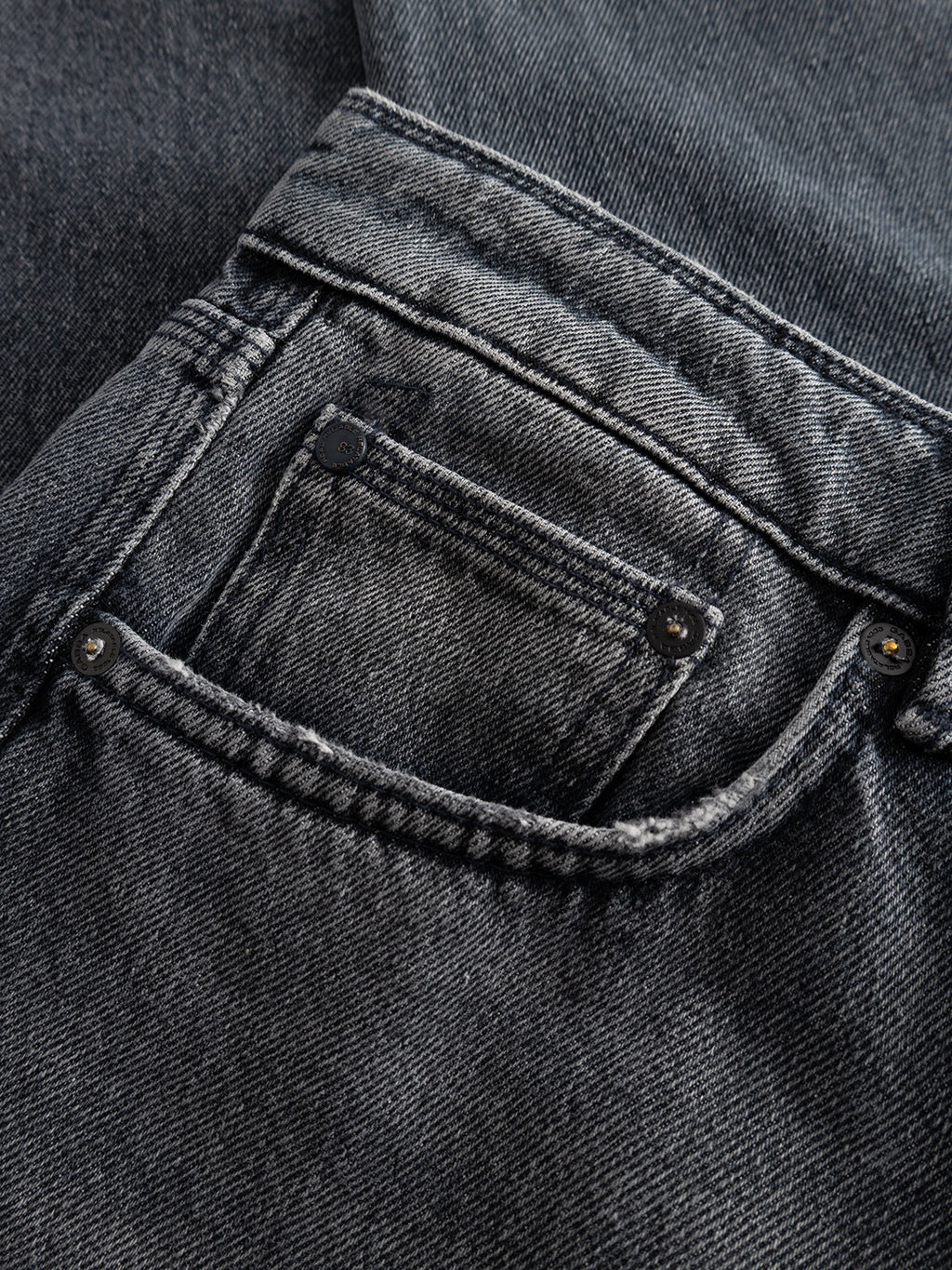 Close-up of a GABmax Primesto WW0030 Jeans pocket by Gabba in grey denim, highlighting the detailed stitching, metal rivets, and the textured 3x1 heavy denim fabric and seams.