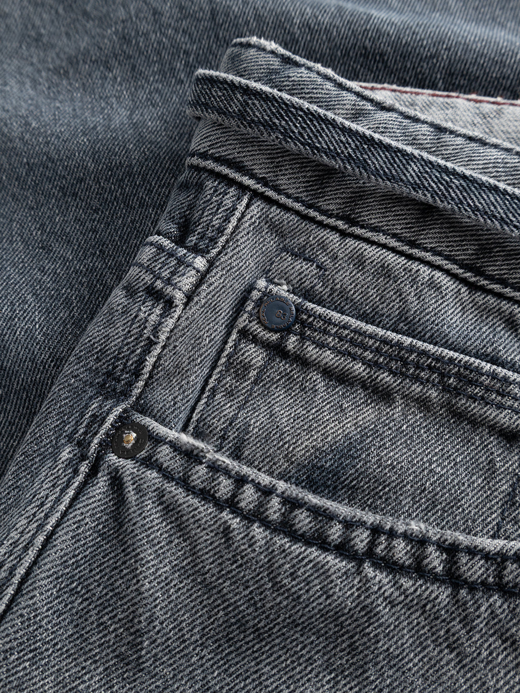 Close-up of the Gabba GABnoah Primesto WW0030 Jeans in grey denim, highlighting the front pocket, coin pocket, waistband, and visible stitching. Made from heavy 3x1 denim with a loose straight fit for timeless style and durability.