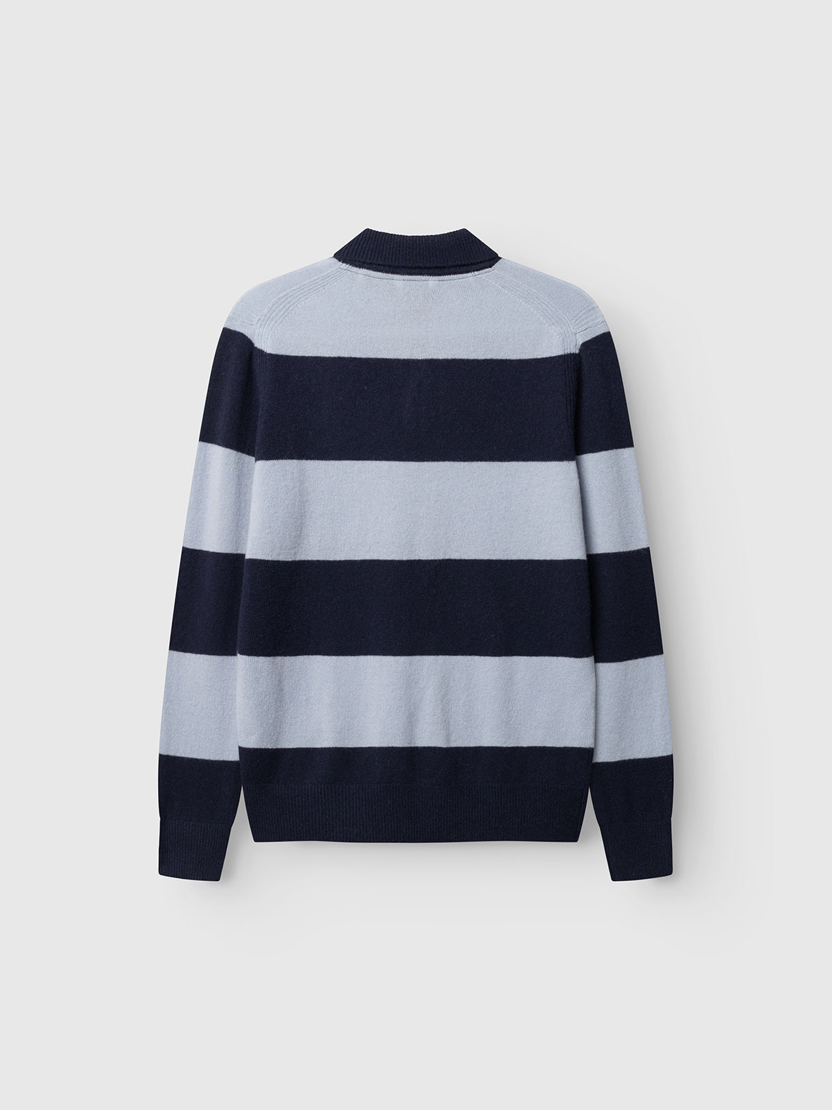 The Gabba GABworren Polo Stripes Aico LS Knit – Navy Stripe is a men’s regular fit pullover featuring wide horizontal stripes in light blue and navy blue. Displayed flat against a white background and shown from the back, this long-sleeve wool polo combines comfort with classic style.