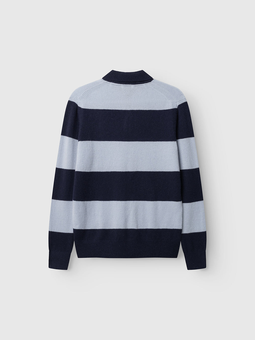 The Gabba GABworren Polo Stripes Aico LS Knit – Navy Stripe is a men’s regular fit pullover featuring wide horizontal stripes in light blue and navy blue. Displayed flat against a white background and shown from the back, this long-sleeve wool polo combines comfort with classic style.
