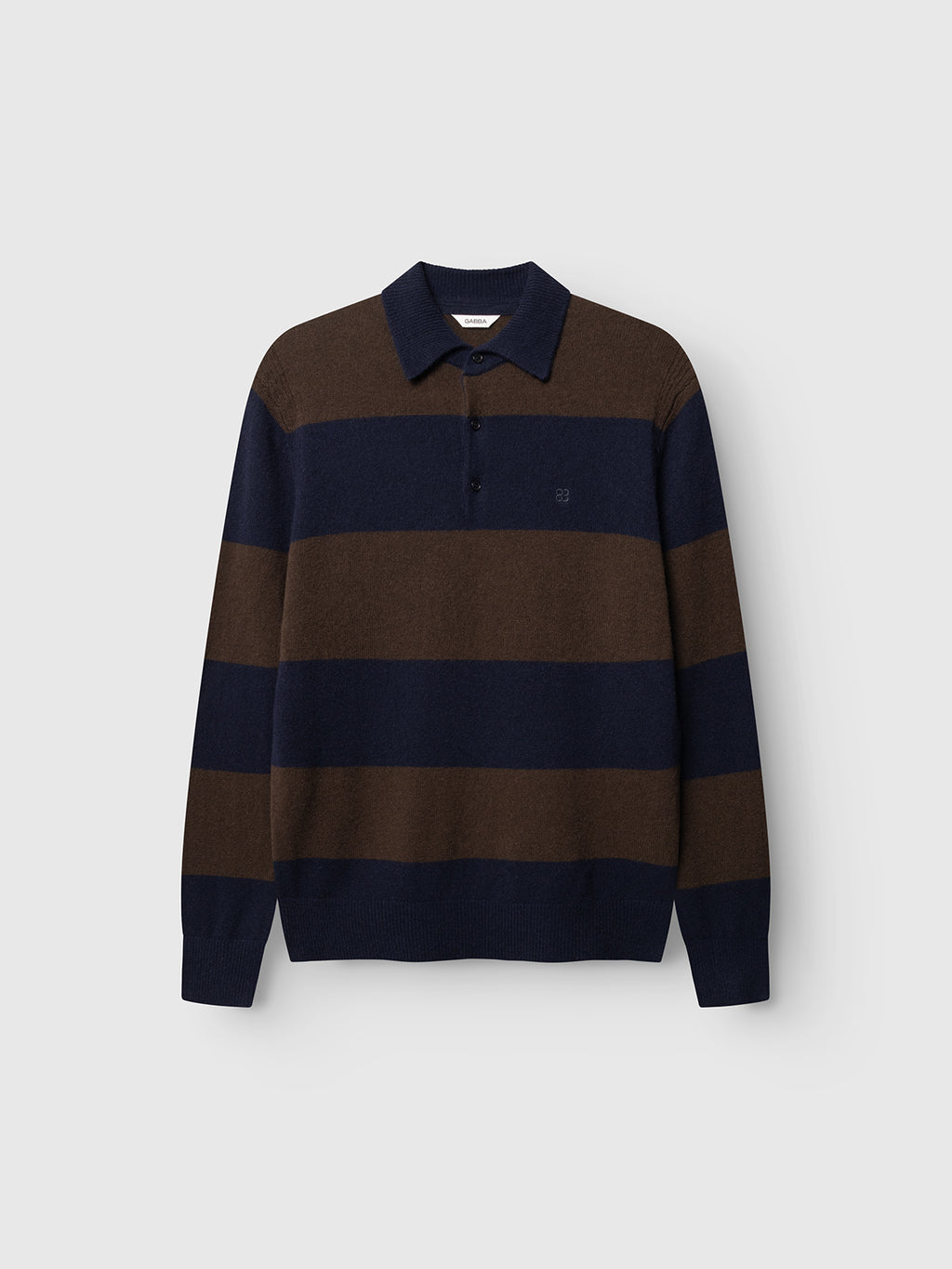 The Gabba GABworren Polo Stripes Aico LS Knit - Brown Stripe is a striped knit sweater featuring wide horizontal navy blue and brown stripes, crafted from soft wool with a classic polo collar and button-up neckline, displayed against a plain light background.