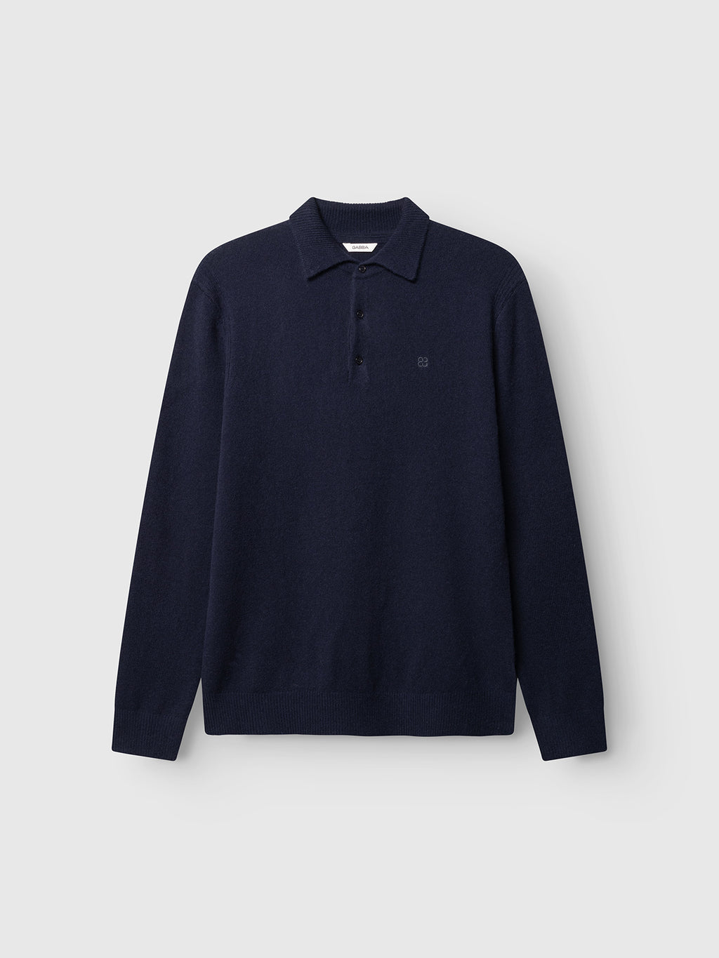 The GABworren Polo Aico LS Knit in navy by Gabba is a long-sleeve knit polo shirt featuring a classic collar, three-button placket, and ribbed cuffs and hem, shown against a plain light gray background.