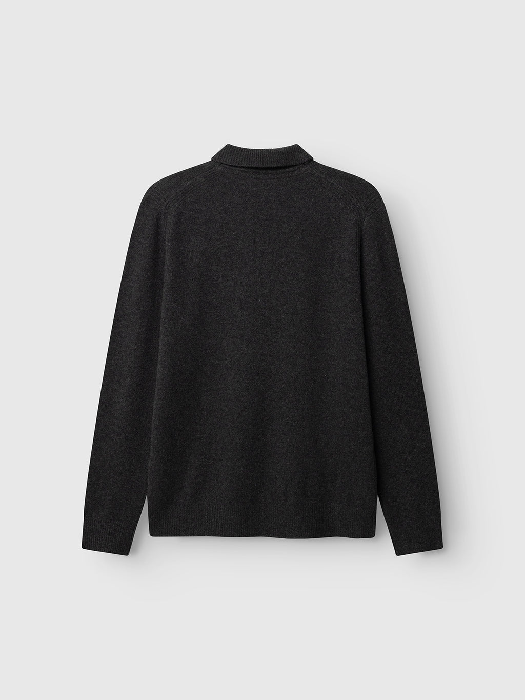 The Gabba GABworren Polo Aico LS Knit in Dark Grey Mel. is shown from the back against a light gray background. This men’s regular fit sweater is crafted from soft wool knit and features a plain, long-sleeve design with a ribbed polo collar and ribbed cuffs.