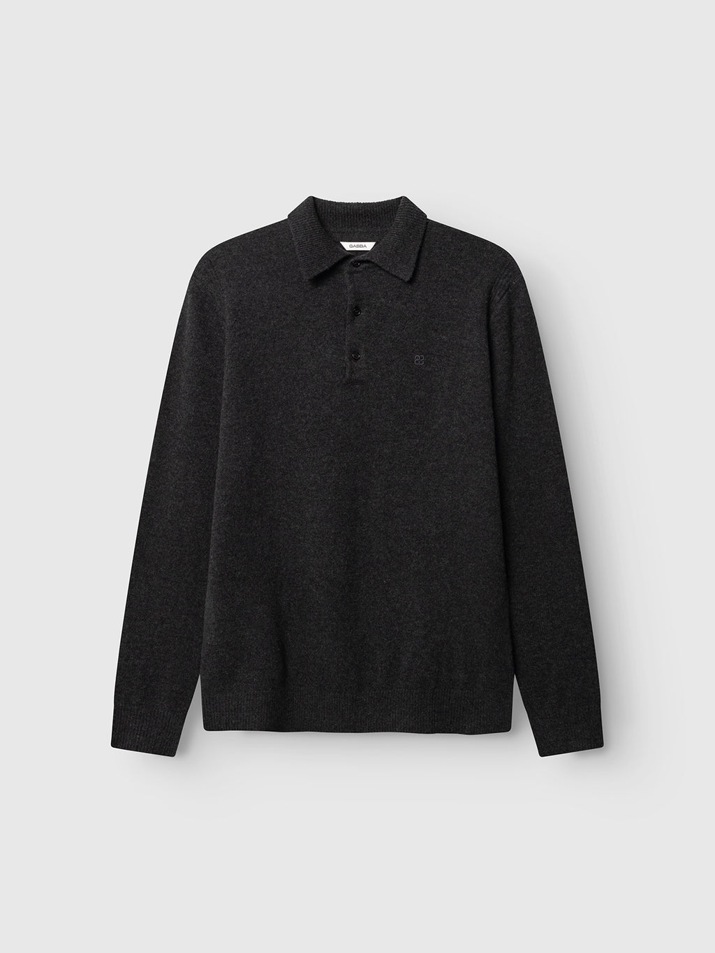 The Gabba GABworren Polo Aico LS Knit in Dark Grey Mel is a long-sleeve polo shirt made from soft wool knit for comfort, featuring a ribbed polo collar and three-button placket, shown against a plain light grey background.