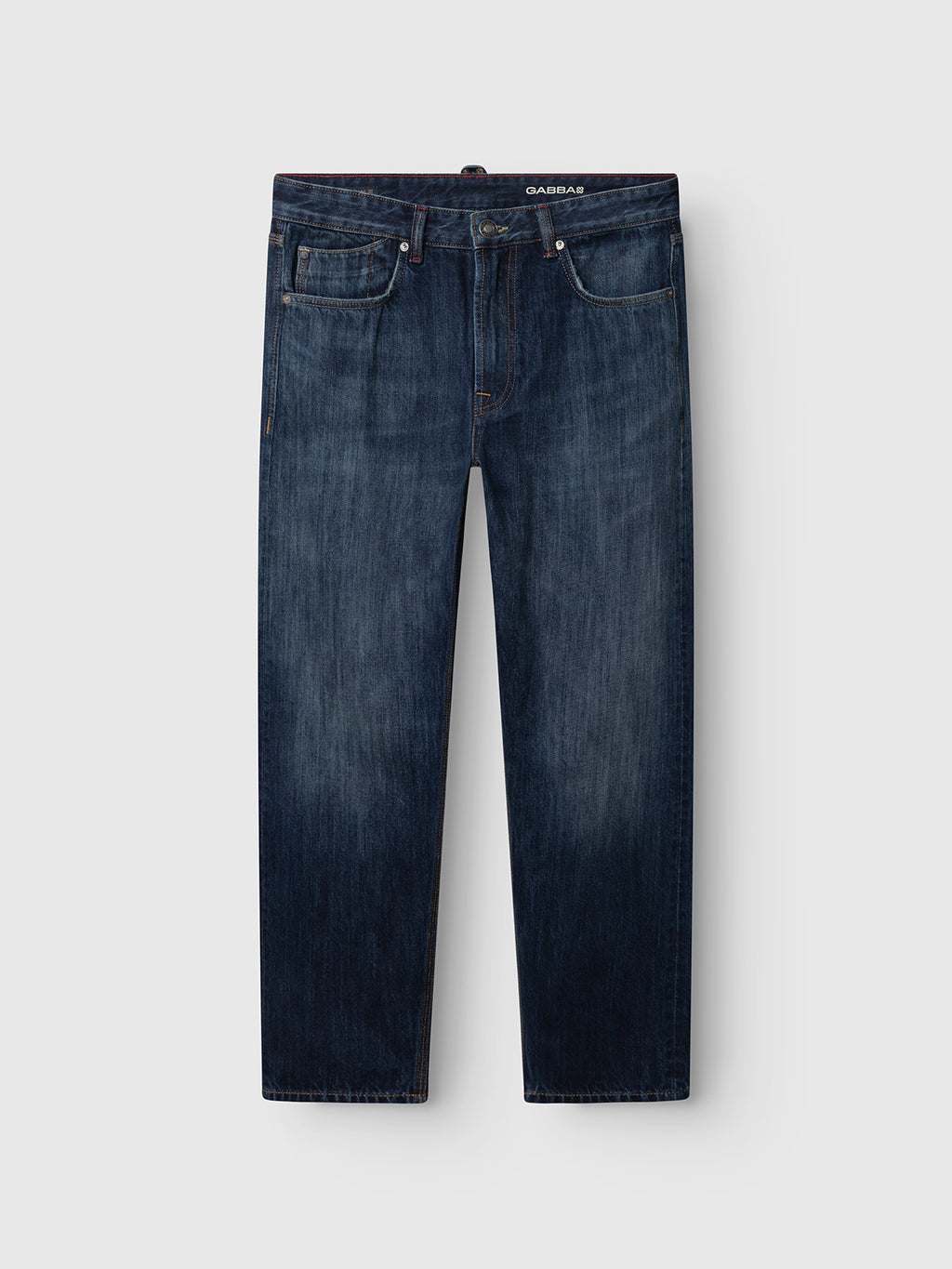 Introducing the Gabba GABcarl Selvedge DS0005 Jeans in dark blue denim—a pair of loose tapered fit jeans with a classic five-pocket design, crafted from Candiani recycled cotton selvedge denim, featuring belt loops and a button closure. Shown laid flat on a white background.