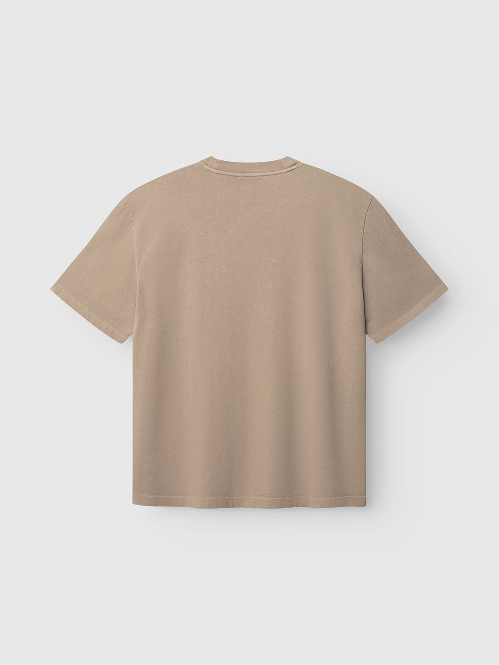 The Gabba GABnigel Wix Pkt Boxy Hour SS T-Shirt in Sand Crocker is laid flat with the back facing up against a white background.