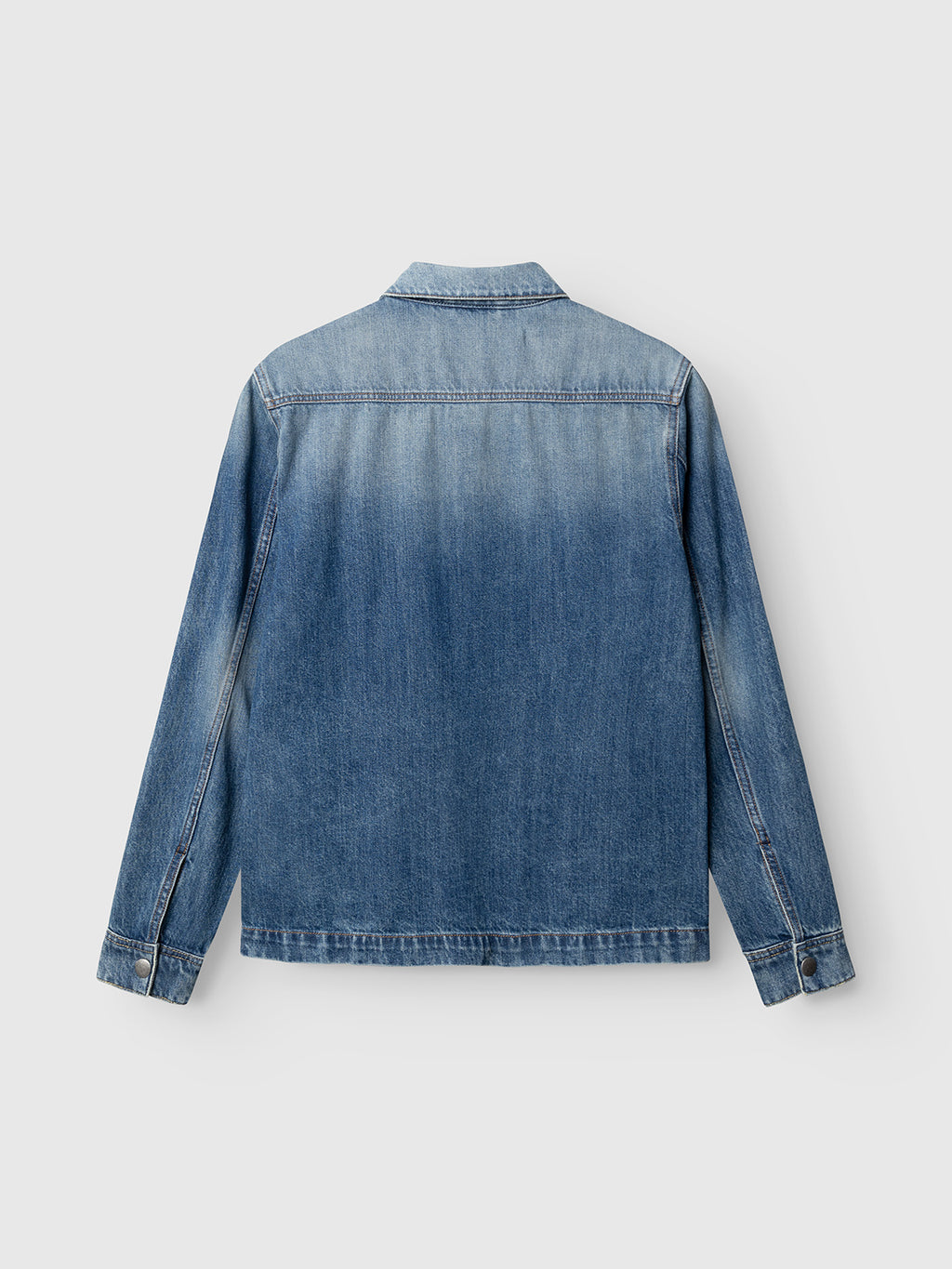 A back view of the Gabba GABbeta Wolv DS0004 LS Overshirt in dark blue denim, crafted from cotton. This long-sleeve jacket presents a faded, slightly gradient laser-washed finish and features buttoned cuffs, creating a subtle workwear-inspired style with no visible branding or embellishments.