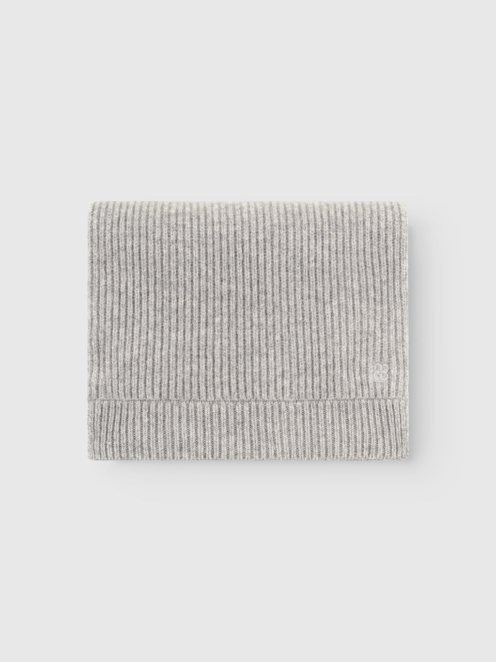 The Gabba GABeast Flash Scarf in Grey Mel is neatly folded on a plain white background, showcasing it as a perfect winter accessory.