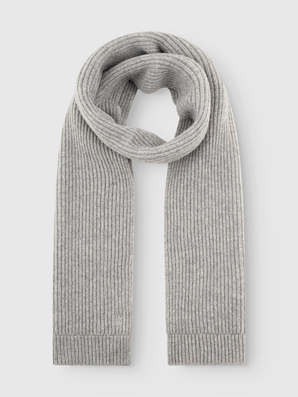 The GABeast Flash Scarf - Grey Mel by Gabba is neatly laid out on a flat, white background. The long, light gray rib-knit scarf has straight ends and is looped in the middle, showcasing its soft and cozy texture—a perfect winter accessory for cold weather.