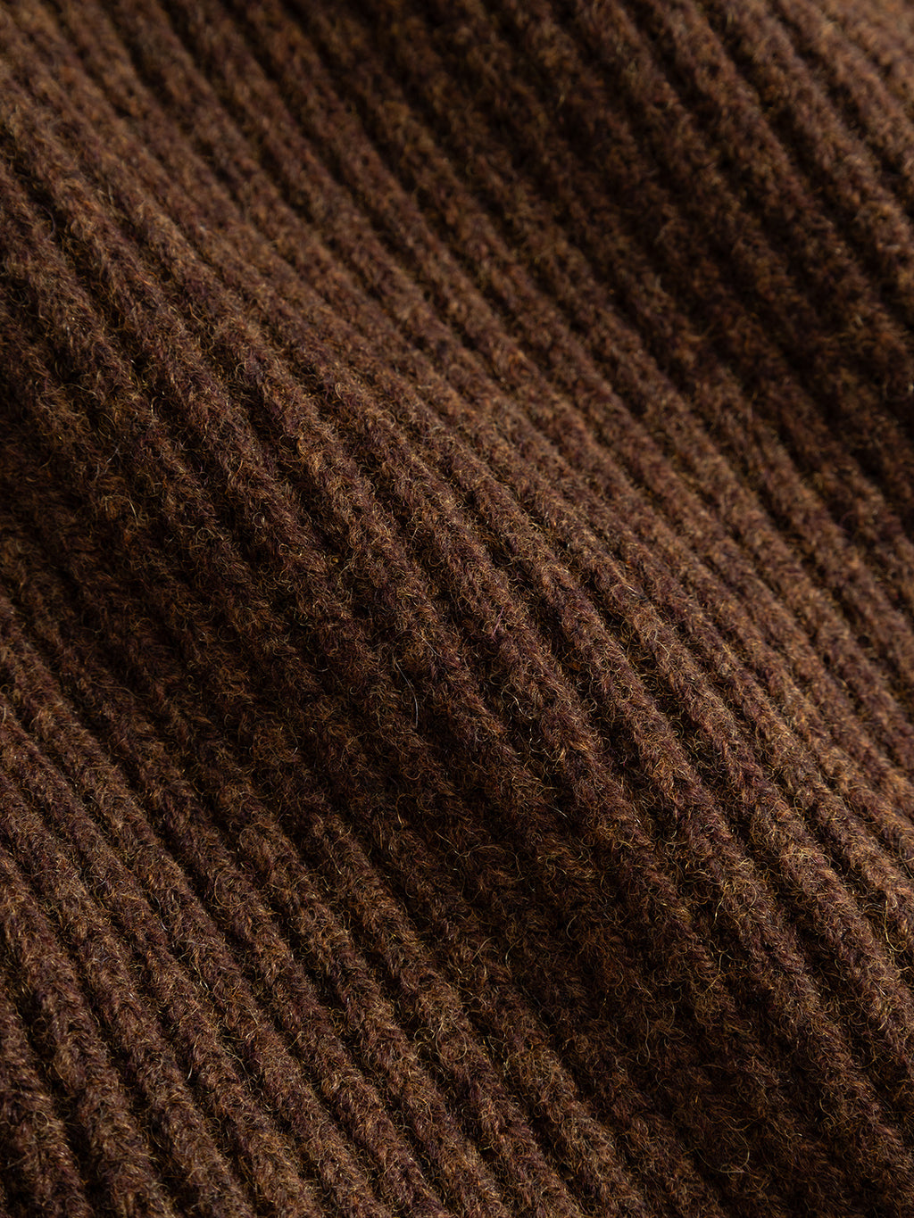 Close-up of the GABeast Flash Scarf in Brown Slate by Gabba, highlighting its ribbed knitted texture with diagonal ridges and subtle color variations—showcasing the soft, cozy surface that makes it an ideal winter accessory.