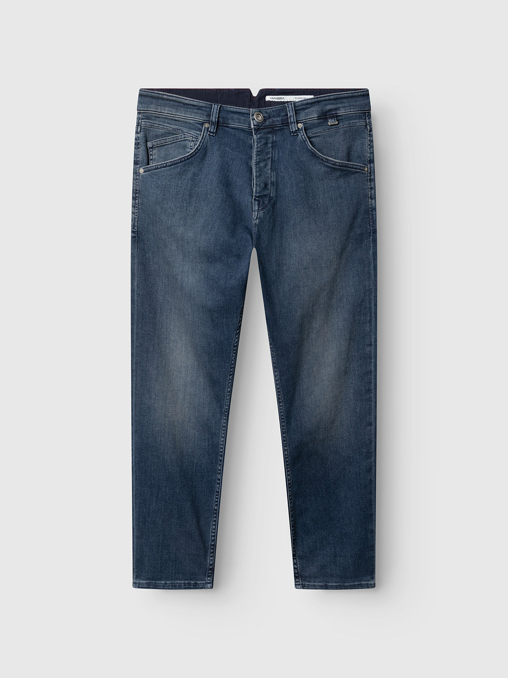 The GABalex Cropped Nham RS2113 Jeans by Gabba in a dark blue denim wash feature a straight-leg silhouette, button and zip closure, front and back pockets, and subtle thigh fading. Crafted from performance comfort ISKO denim, they are shown laid flat on a light gray background.
