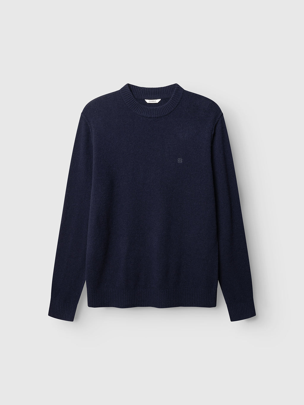 The Gabba GABtokota Element Aico LS Knit - Navy sweater is displayed on a plain light gray background. This long-sleeve crew neck knit is crafted from soft wool for everyday comfort and features ribbed cuffs, collar, and hem in a simple, classic design.
