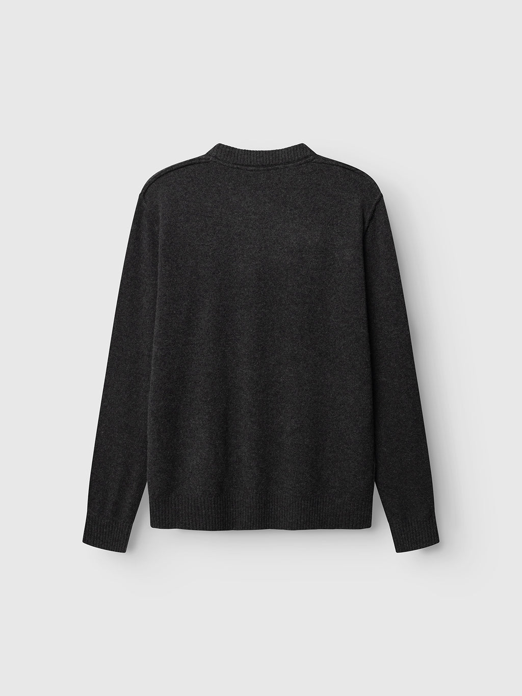 The GABtokota Element Aico LS Knit in Dark Grey Mel. from Gabba is displayed laid flat with the back facing up, showcasing its ribbed crew neck, cuffs, and hem long sleeves, all against a plain light background.