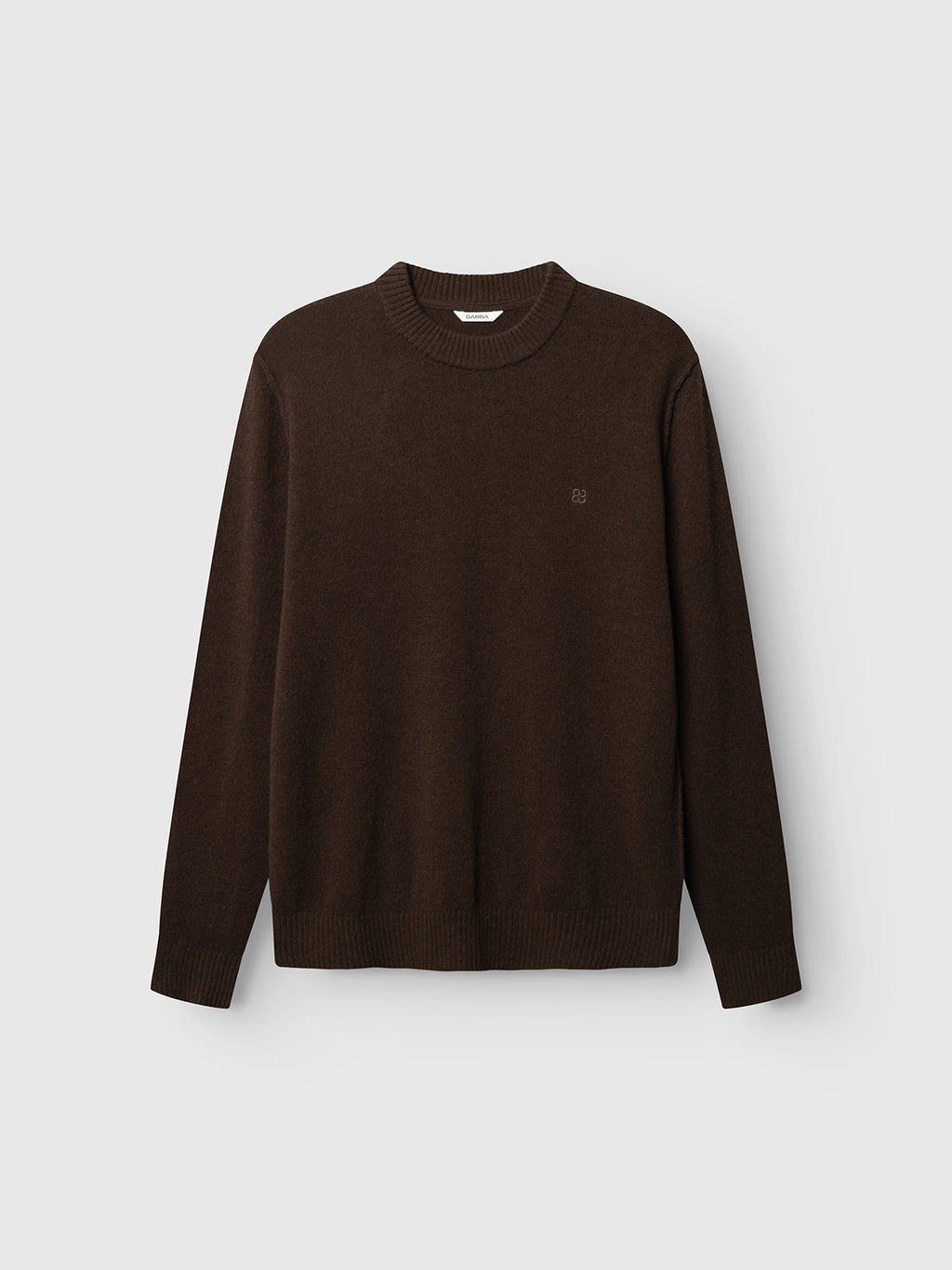 The Gabba GABtokota Element Aico LS Knit in Brown Slate is a timeless, long-sleeved crew neck sweater crafted from soft wool for everyday comfort. Showcasing understated ribbed cuffs and hem, along with a subtle embroidered logo on the left chest, this classic Gabba knit is presented against a light gray background—an essential piece for any wardrobe.