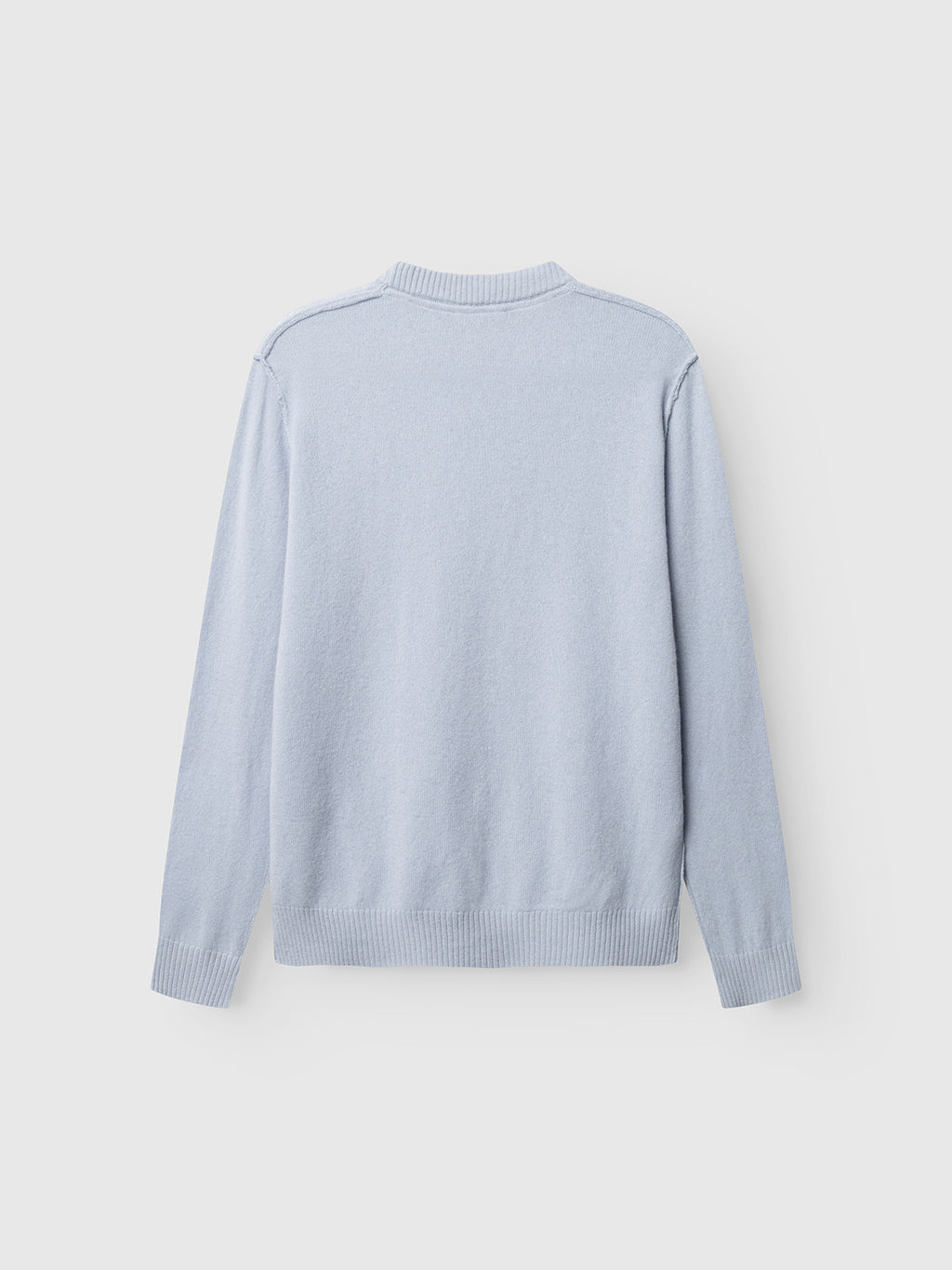 The Gabba GABtokota Element Aico LS Knit in Dusty Blue is displayed laid flat with the back facing up against a plain white background. Crafted for everyday comfort, this soft wool sweater features long sleeves, a crew neck, and ribbed cuffs and hem.