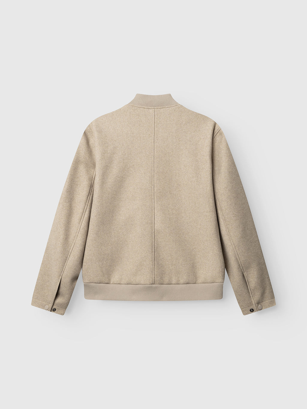 The GABmatheo Plain Bomber Jacket - Sand by Gabba is displayed on a flat white background, showcasing its back side. Made from a wool-inspired fabric in a beige hue, this long-sleeve bomber jacket features a ribbed collar, hem, and cuffs with stylish button details at the cuffs—an elevated touch to your casual outerwear collection.
