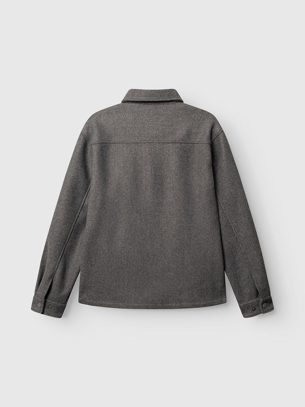 The GABtheo City Jacket in Dark Grey by Gabba is displayed from the back on a plain light gray background. This long-sleeve overshirt jacket features a classic collar, buttoned cuffs, and a straight hem, crafted from wool-inspired fabric for comfortable everyday layering.