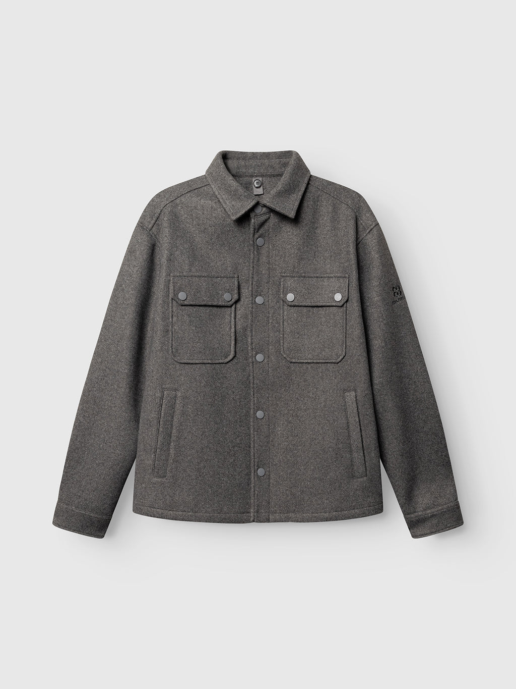 Introducing the Gabba GABtheo City Jacket in Dark Grey: a modern button-up overshirt jacket featuring a classic collar, two chest flap pockets with buttons, and two side pockets. Crafted from a wool-inspired fabric, this versatile piece is perfect for everyday layering with its sleek and contemporary design.
